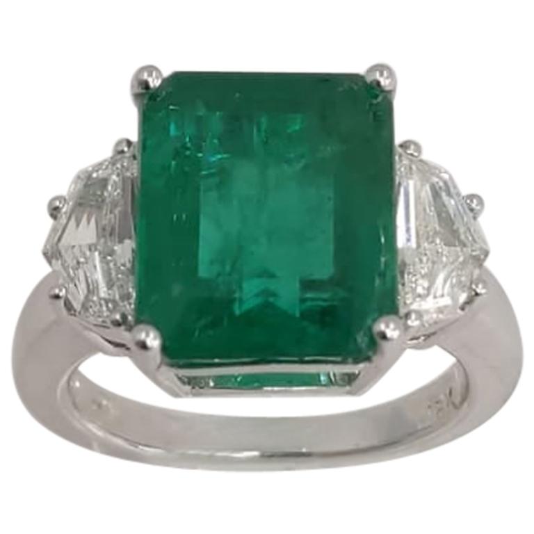 18 Karat White Gold Emerald Cut Emerald and Diamond Three-Stone Ring
