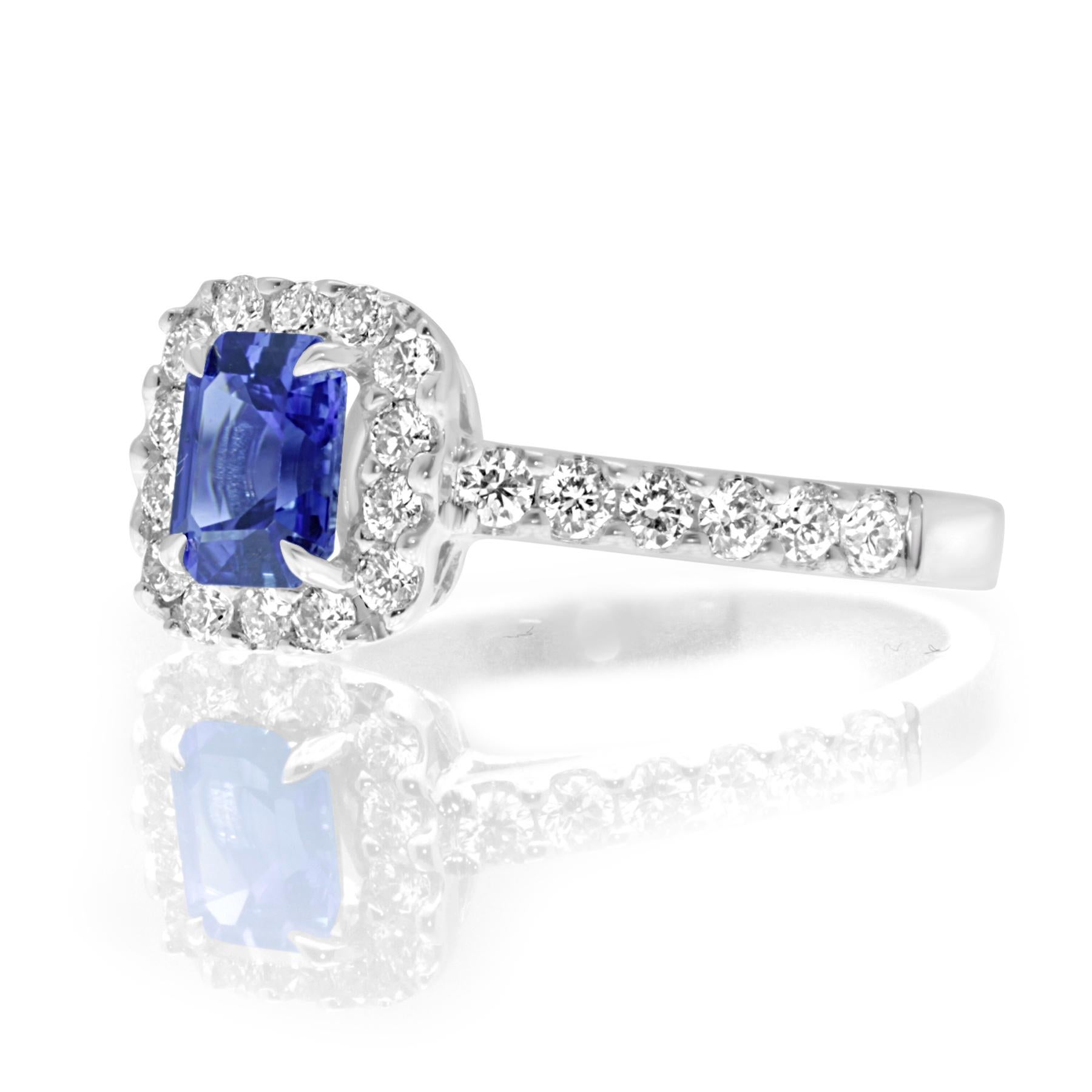 A 0.89 carat, emerald cut sapphire stone surrounded by 0.57 carat white diamonds set in 18 karat white gold.
Not every emerald cut sapphire stone has this level of clear, blue depth in it. No matter when or where you will wear it, you will shine the