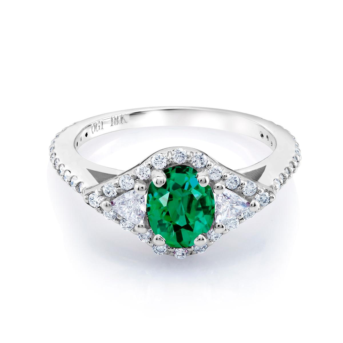 18 karat white gold emerald and diamond cocktail ring 
Ring finger size 6.5 
Diamond carat weight 0.45 
Trillion diamond carat weight 0.25 
Emerald carat total weight 0.98
Diamond quality G VS
One of a kind ring 
New ring 
Ring can be resized 
Our