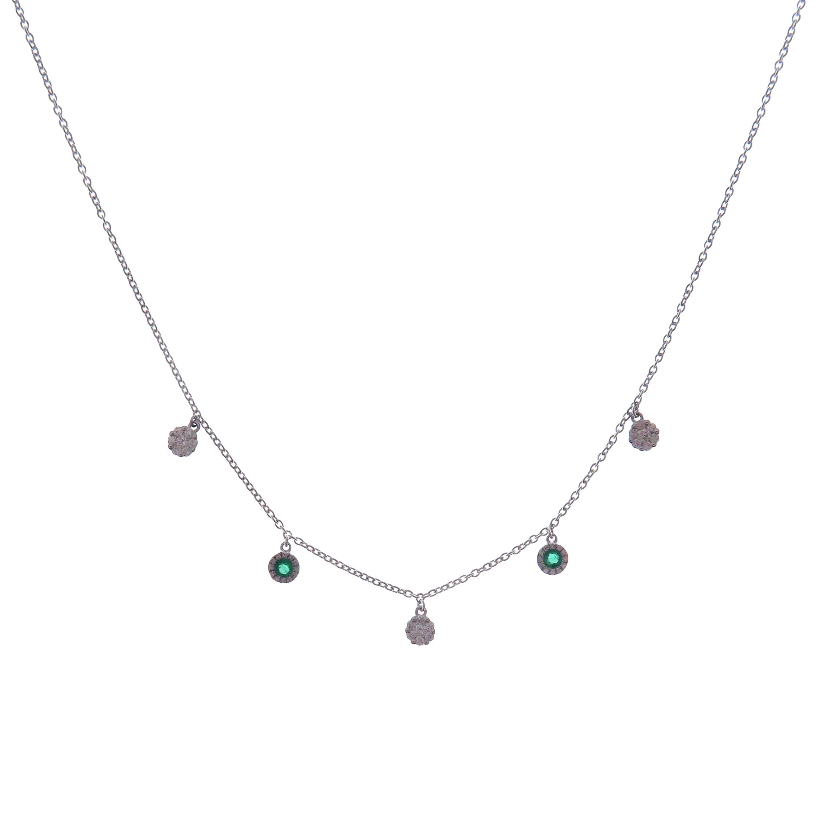 This delicate necklace is crafted in 18-karat white gold, weighing approximately 0.30 total carats of SI-H Quality white diamonds and 0.13 total carats of emerald stones. 

Necklace is 16