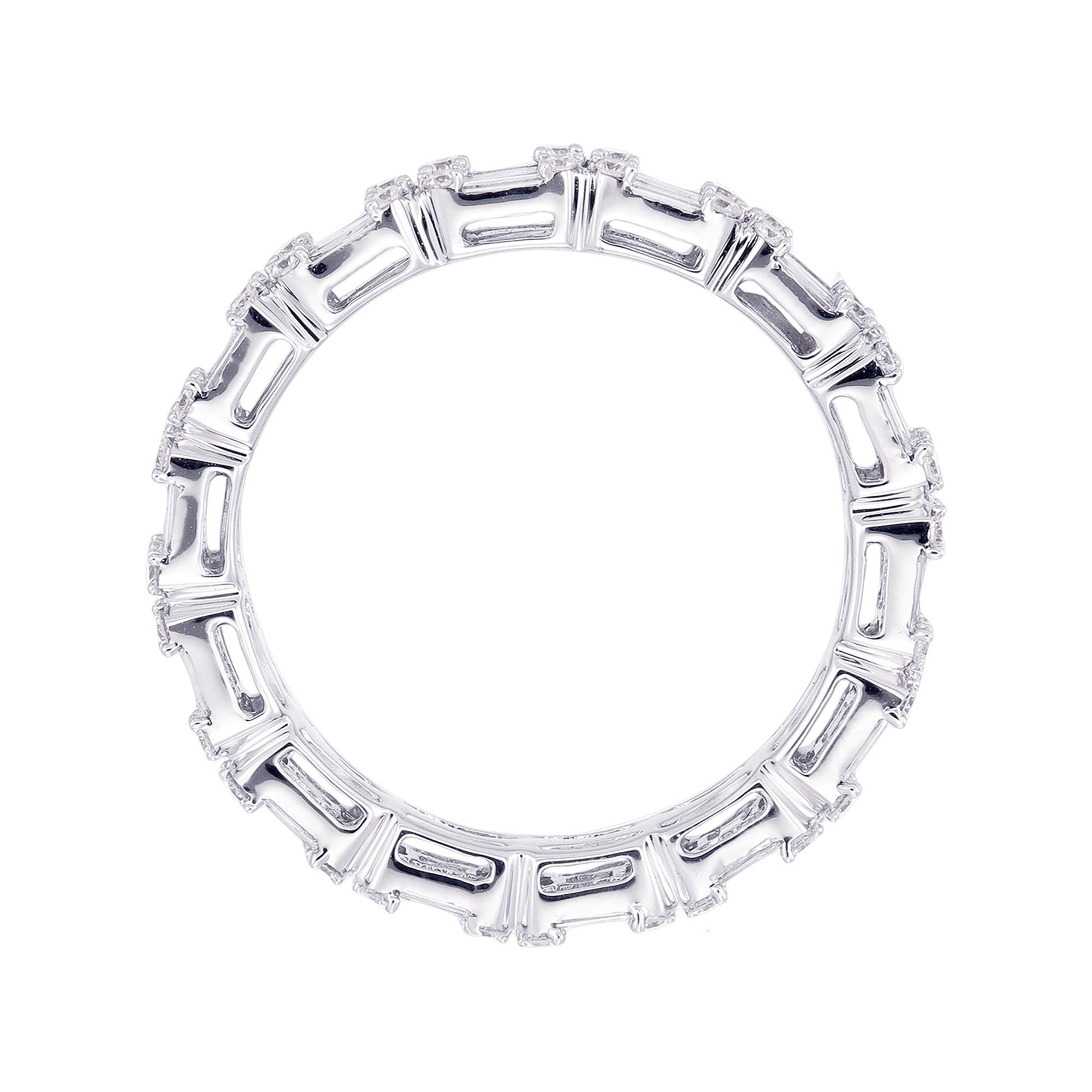 This show-stopping diamond band is carefully crafted with round brilliant and baguette diamonds to create the look of a larger emerald-cut diamond eternity band. Each section appears to contain an Baguette cut diamond in the center.  Closer