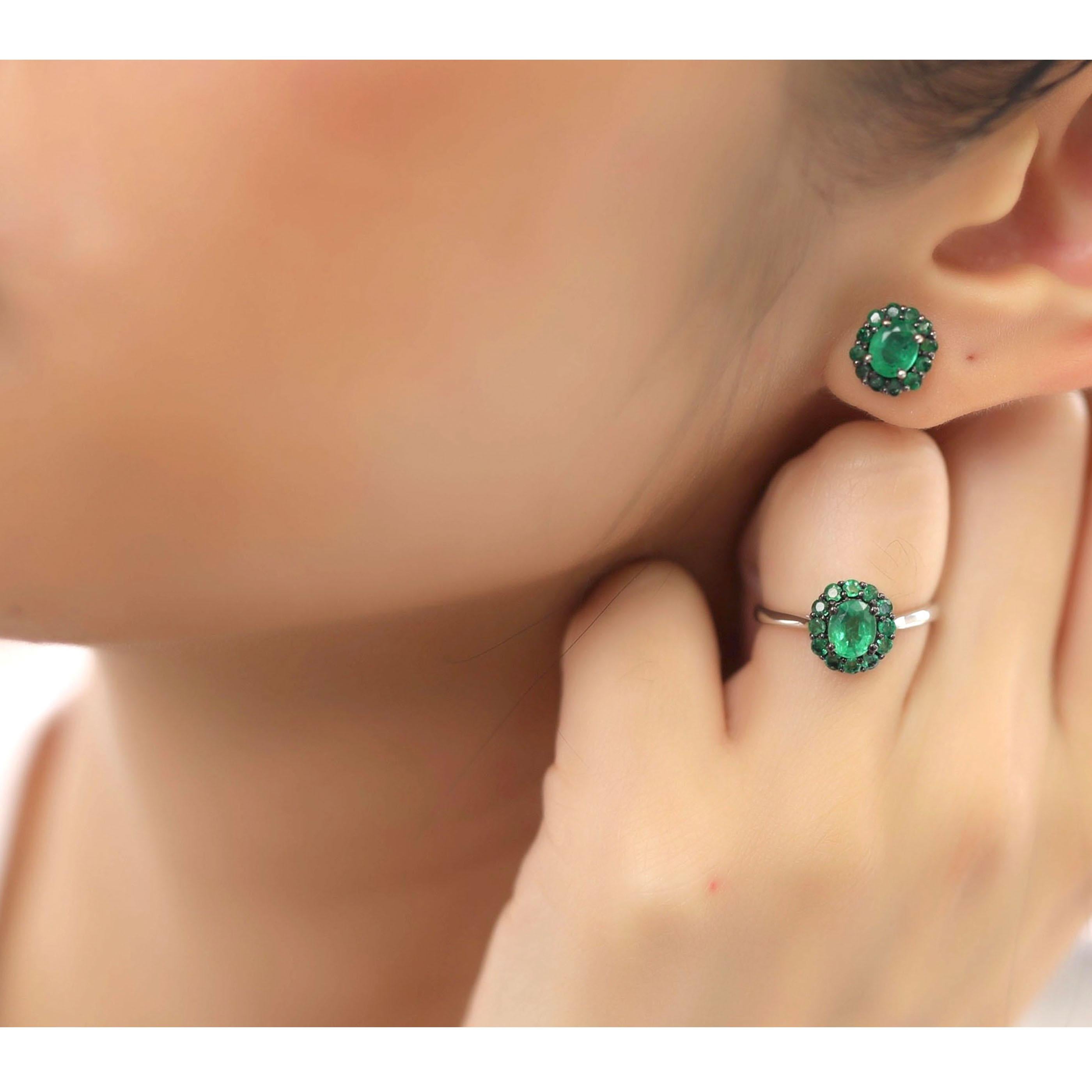 This small emerald earring and ring set is crafted in 18-karat white gold, weighing approximately 2.80 total carats of emerald stones. The ring is comfortable and can be sized 