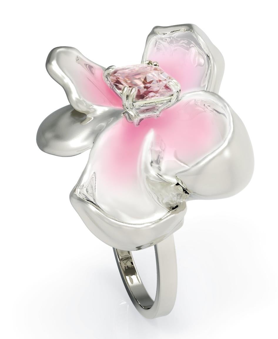 The weight of this contemporary Magnolia Flower engagement ring is approximately 8.5 grams. It is crafted from 18 karat white gold and features a certified Padparadscha sapphire weighing 2.08 carats with a cushion cut and dimensions of 8.24 x 6.26