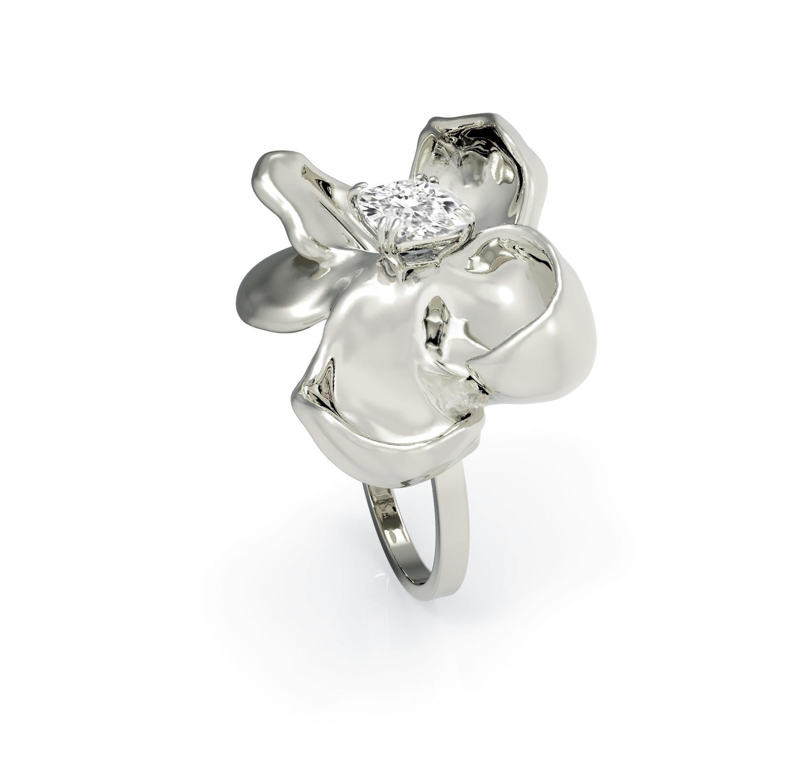 This Magnolia Flower engagement or wedding ring is made of 18 karat white gold and features a crushed ice cushion diamond. Designed by oil painter and 3D jewellery designer Polya Medvedeva, the ring boasts 60 different designs to ensure it looks