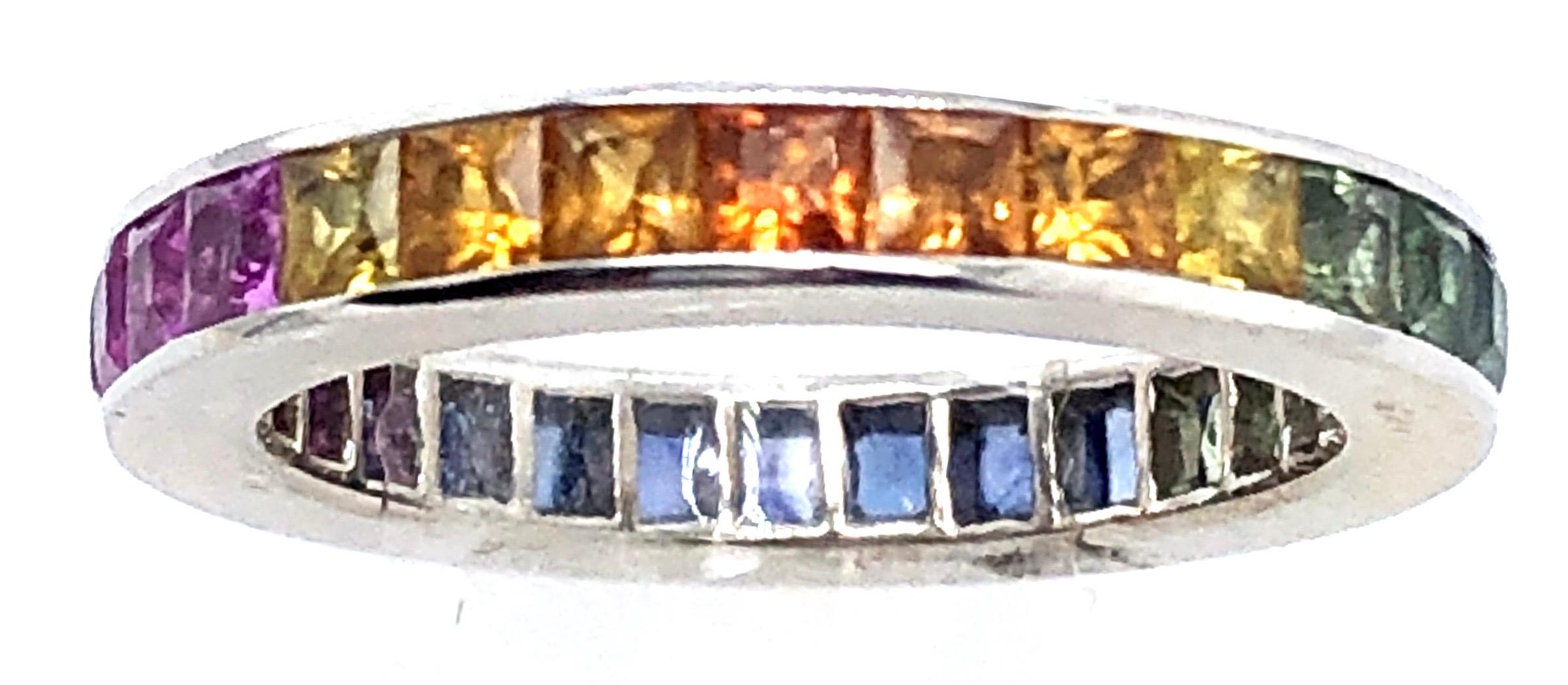 18 Karat White Gold Eternity Band Ring with Semi Precious Stones Size 5.
3.23 grams total weight.
