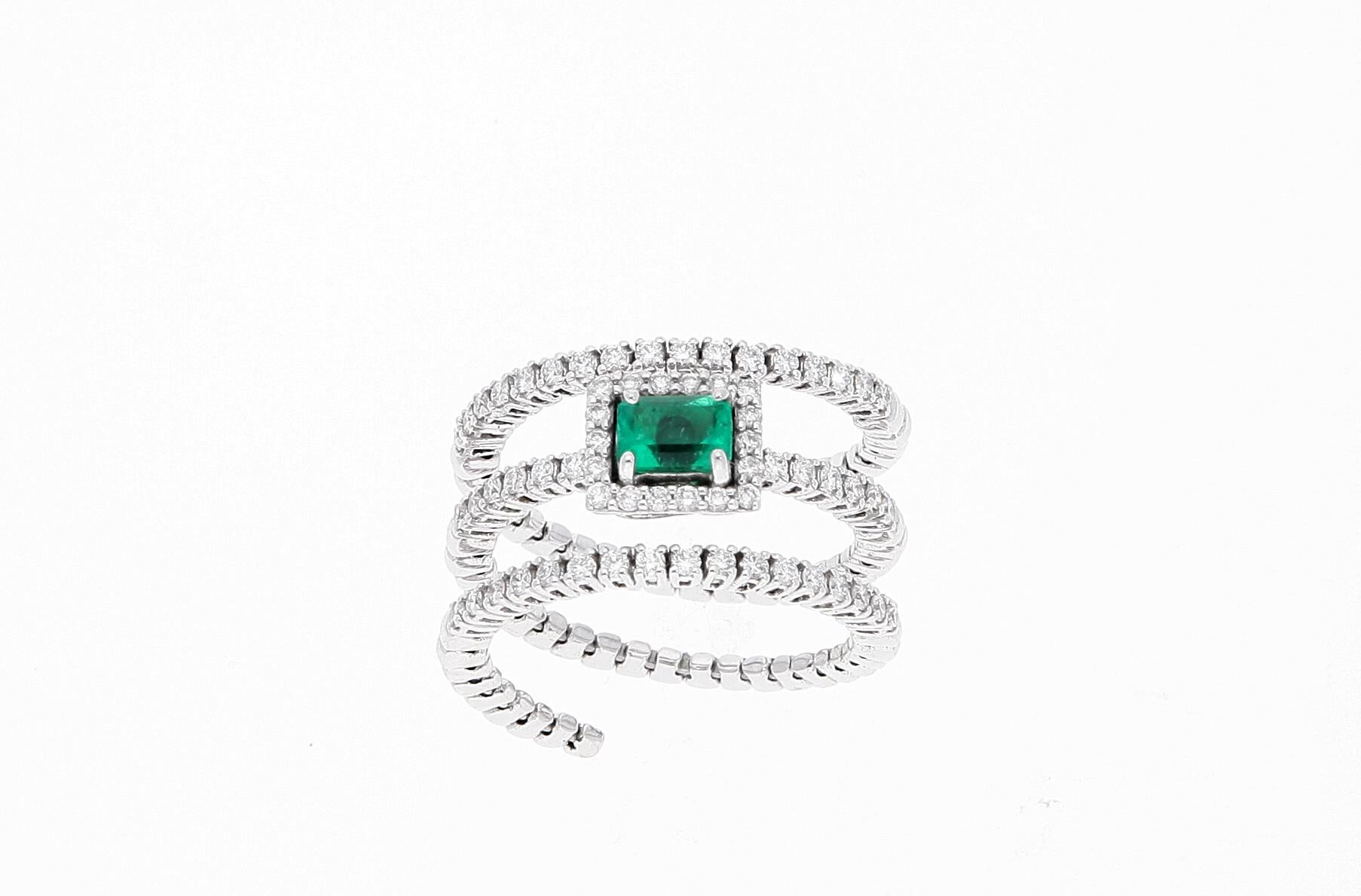 18 karat white gold extendable ring with diamonds lines and one emerald with diamonds around

Total diamonds weight: 0.62 carat
One emerald weight: 0.45 carat
Total weight: 7 grams
Ring size: Size IT 15, USA 7-1/4, FR 54
Approximate size as the ring