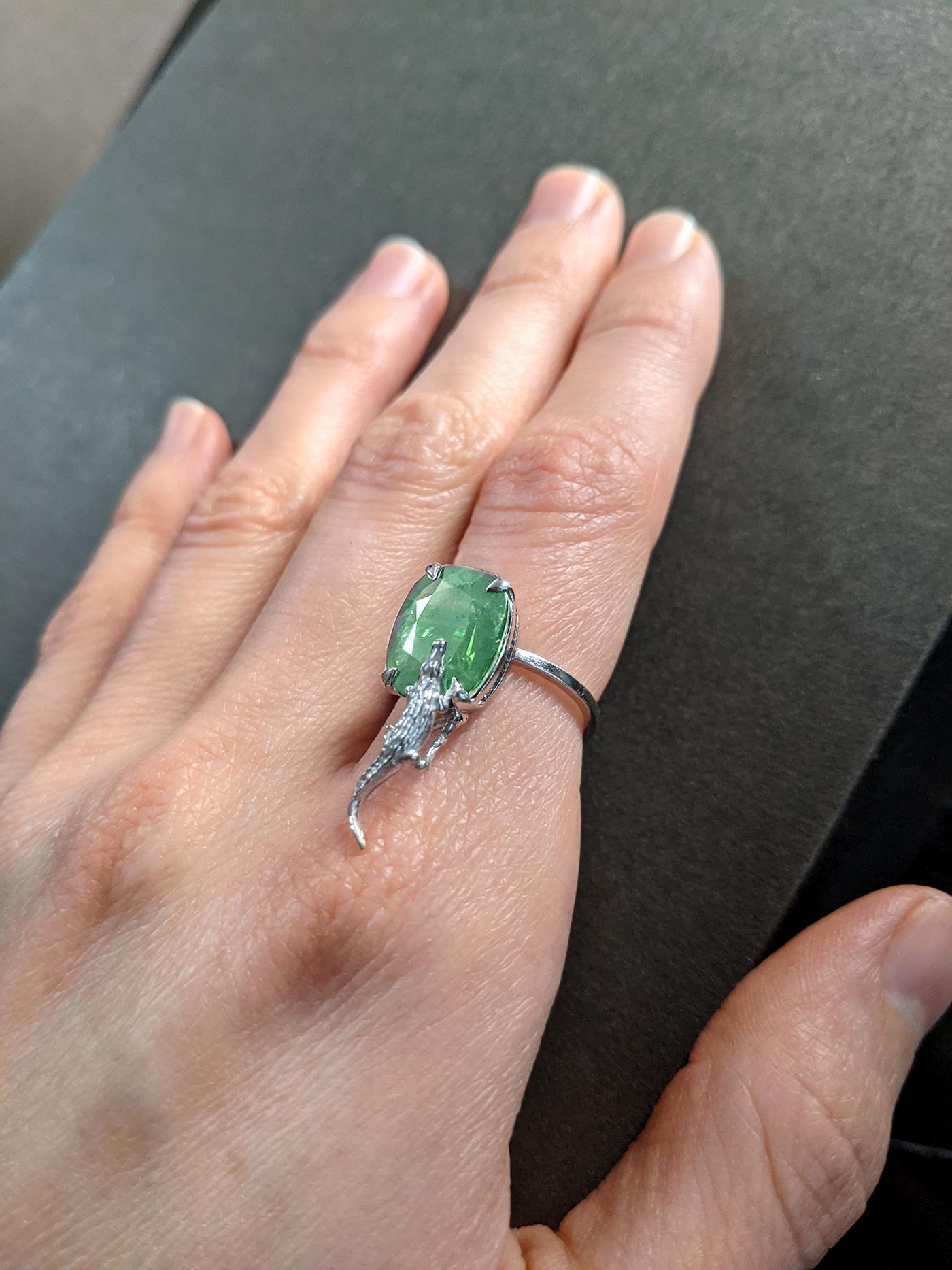 This 18 karat white gold Mesopotamian contemporary fashion ring is encrusted with 3.48 carats natural cushion cut emerald, cold tone, 10.5x9 mm. 

You can order this piece in white, rose or yellow gold, with spinel, sapphire, emerald, tourmaline or