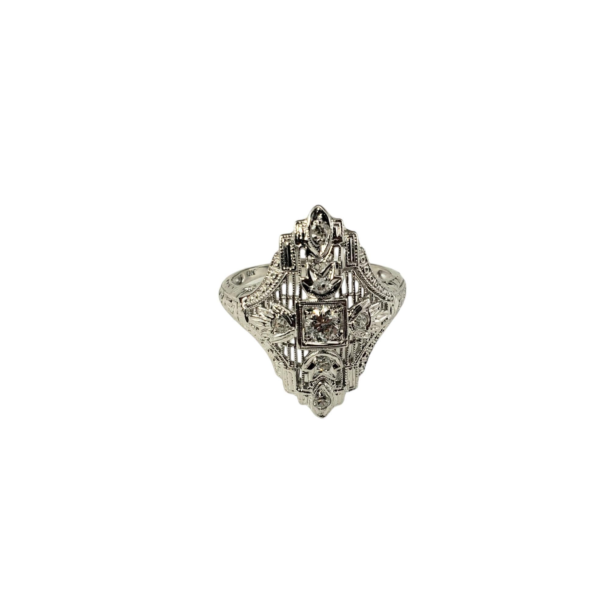 18 Karat White Gold Filigree and Diamond Art Deco Ring Size 7.25

This stunning ring features one round brilliant cut diamond and six round single cut diamonds set in beautifully detailed 18K white gold filigree. 

Top of ring measures 24 mm x 17