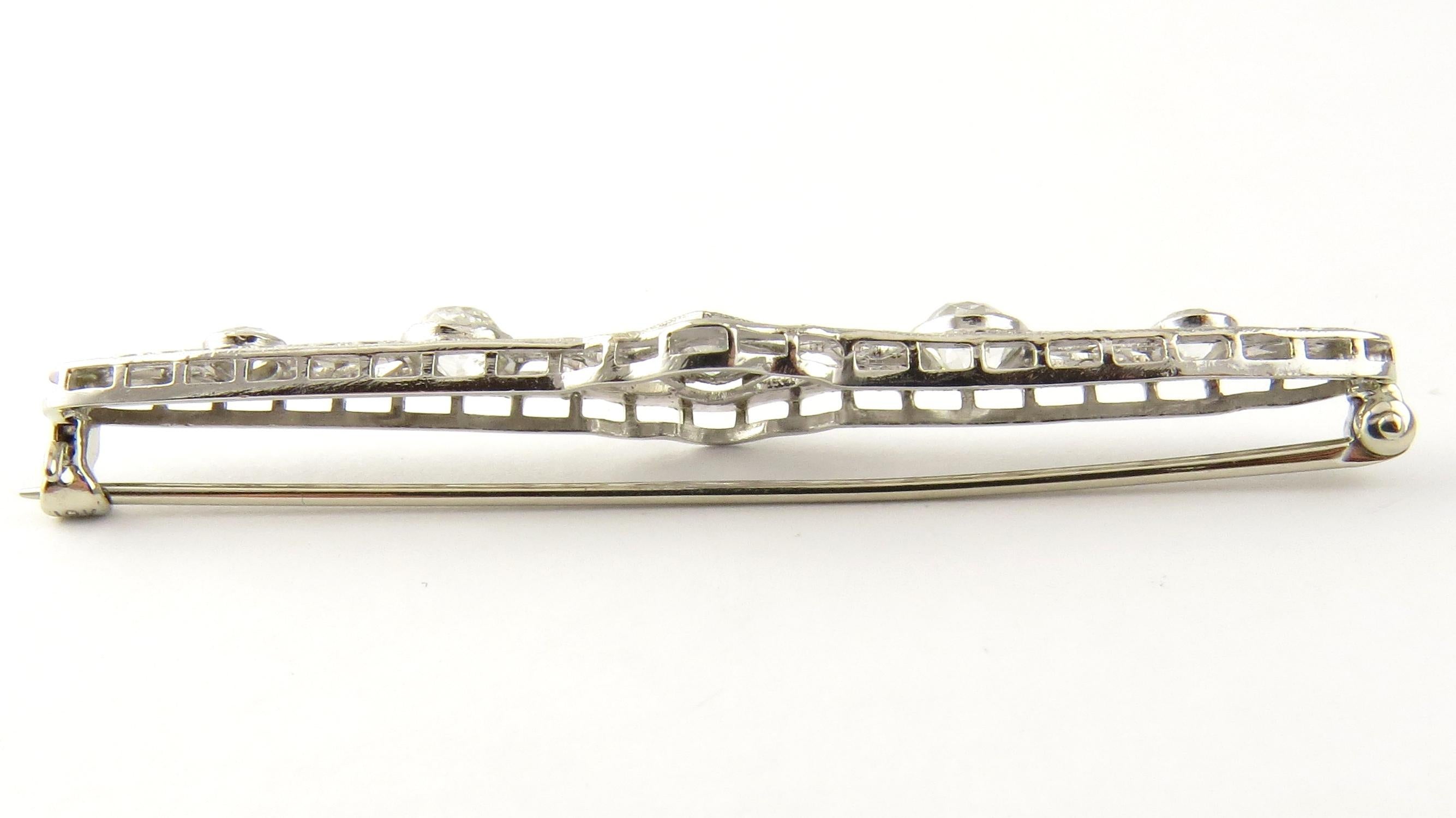 Vintage 18 Karat White Gold Filigree and Diamond Bar Pin

This exquisite bar pin features five old mine cut diamonds (center: .20 ct., sides: .30 ct. each, ends: .10 ct. each) set in beautifully detailed white gold filigree.

Approximate total