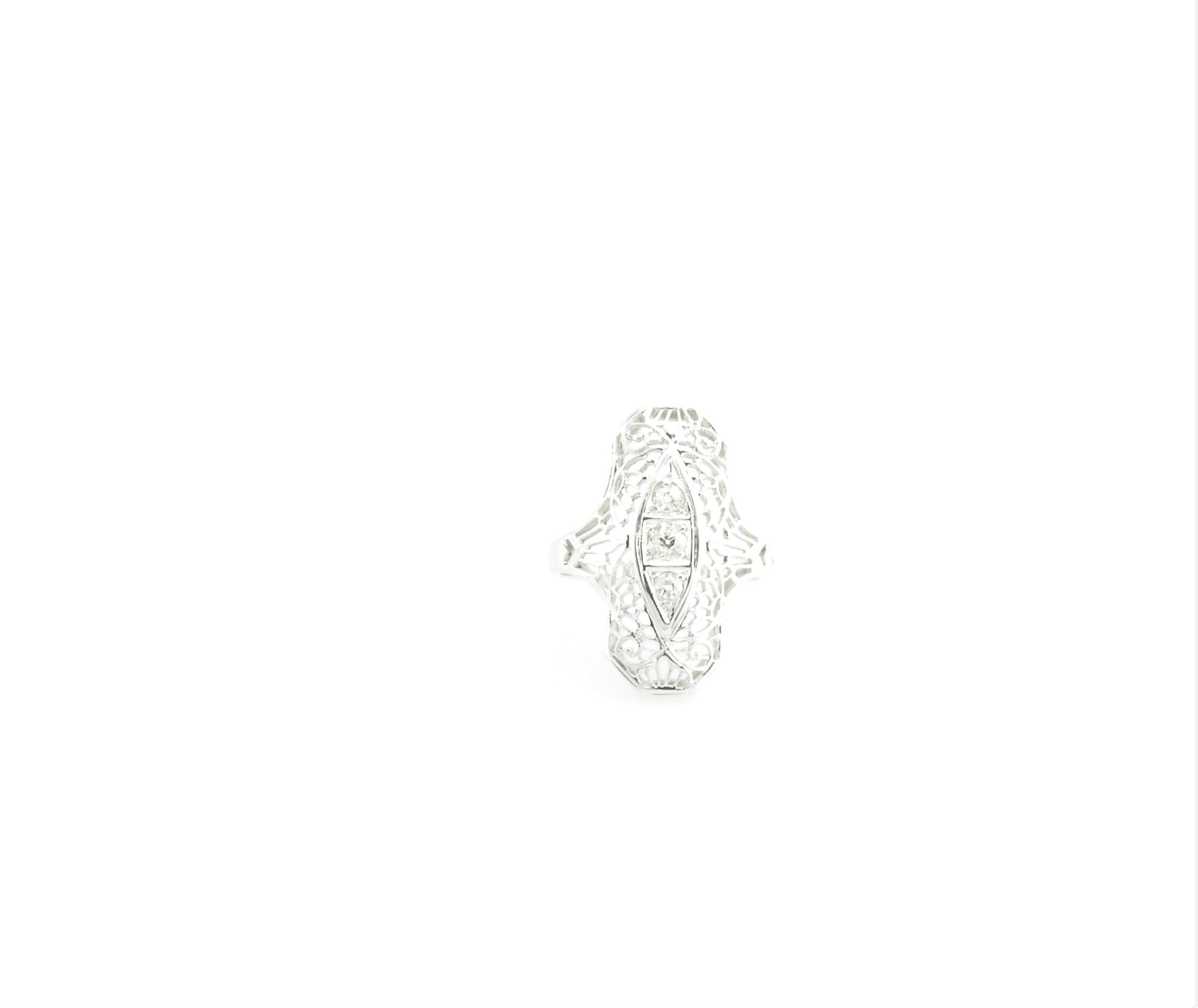 Vintage 18 Karat White Gold Filigree and Diamond Ring Size 4

This lovely ring features three round old mine cut diamonds set in beautifully detailed 18K white gold filigree.

Top of ring measures 22 mm x 13 mm. Shank measures 2 mm.

Approximate