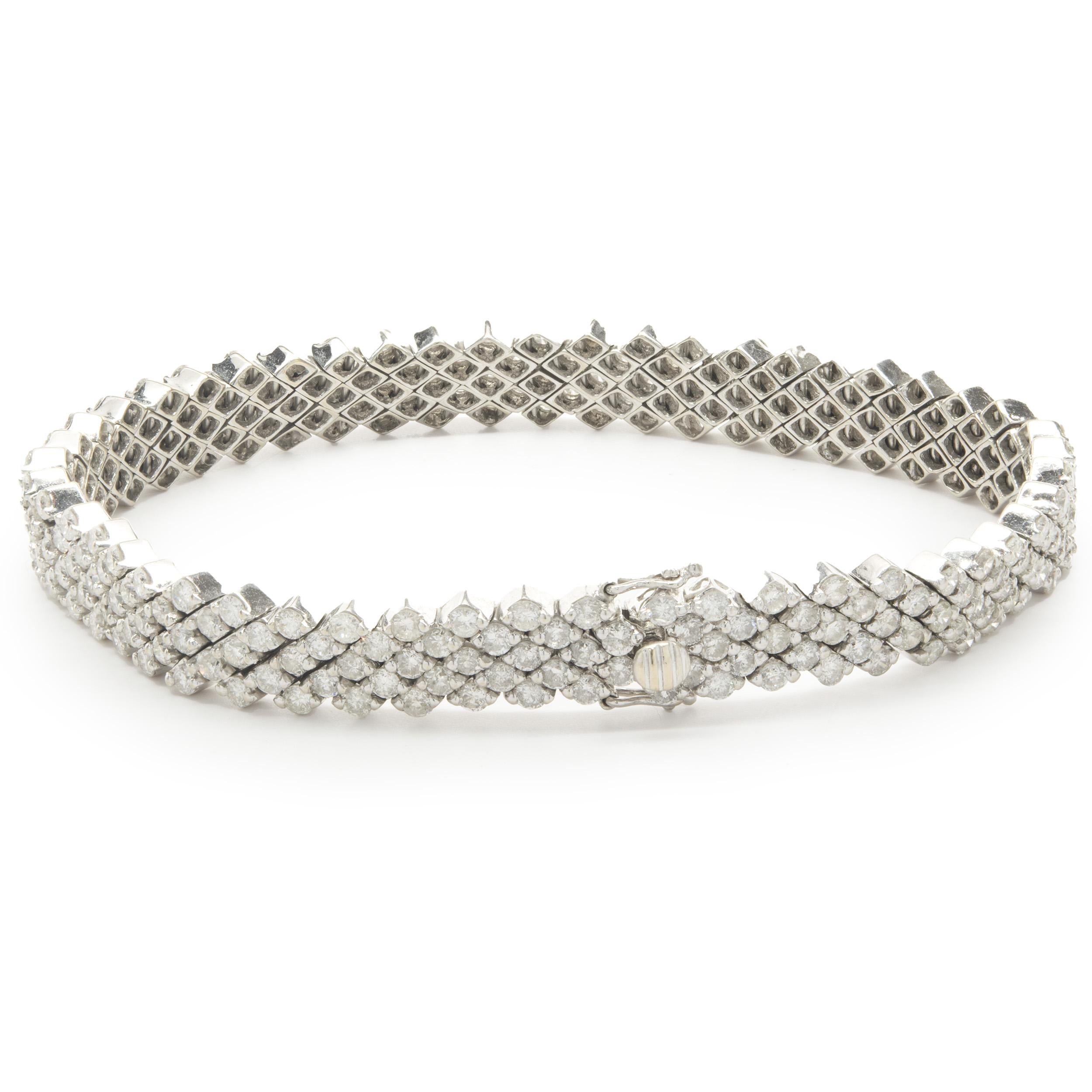 Designer: custom design
Material: 18K white gold
Diamond: round brilliant cut = 7.34cttw
Color: G  / H
Clarity: VS2
Dimensions: bracelet measures 7-inches in length
Weight: 20.53 grams