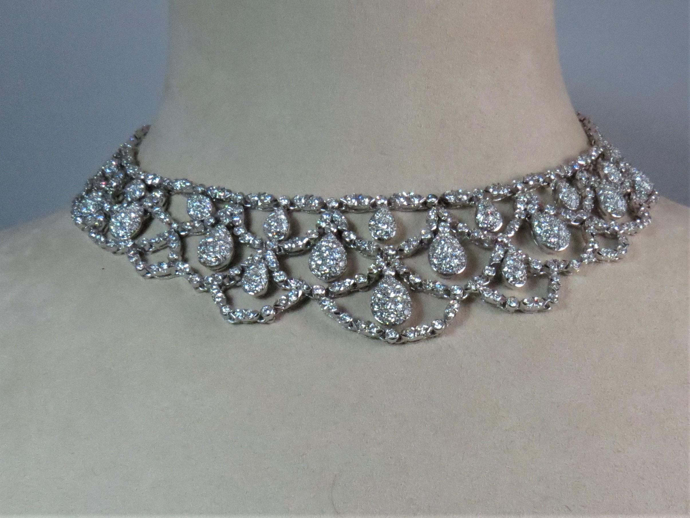 18K white gold flexible diamond choker necklace, prong set with 841 full cut round diamonds weighing 23.03, G-H color, VS clarity. 16 inch length
Last known retail $46,500