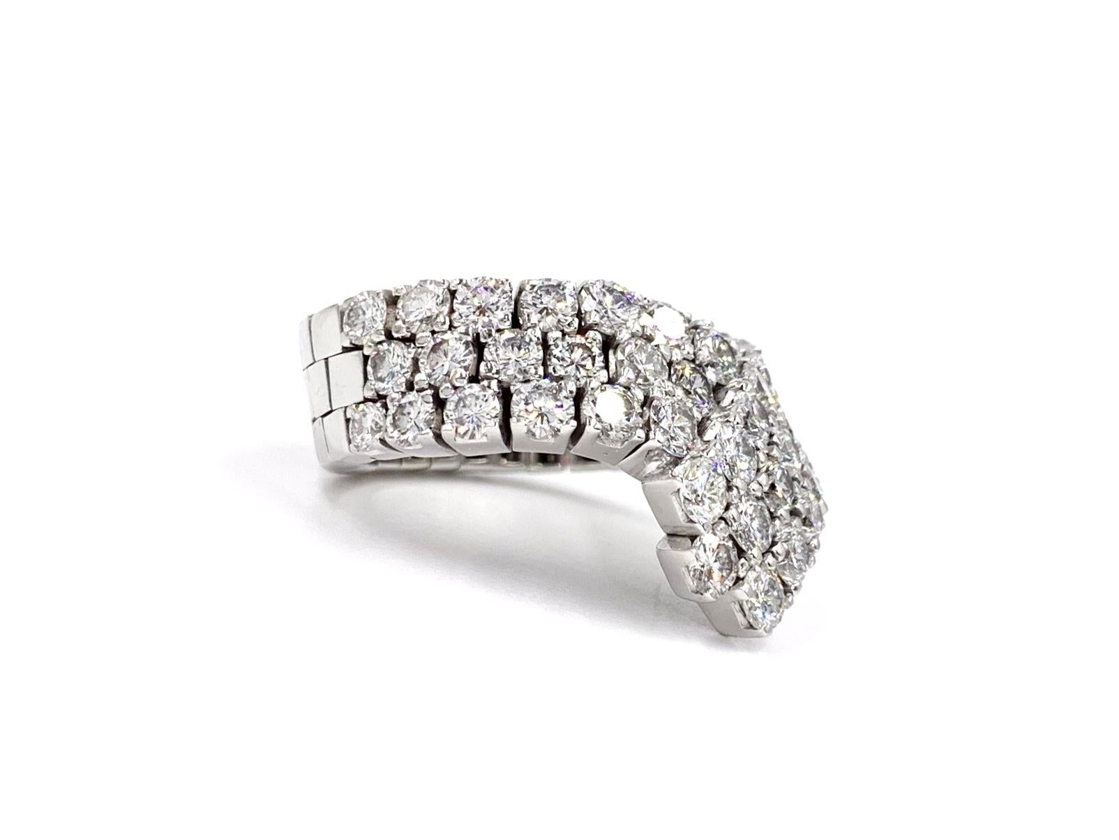 Fashionable and wearable wide V shape 18 karat white gold diamond ring. Ring is made with a slight flexible design for comfort and versatility. 44 high quality round brilliant diamonds have an approximate color of G and VS2-SI1 clarity at 3.97