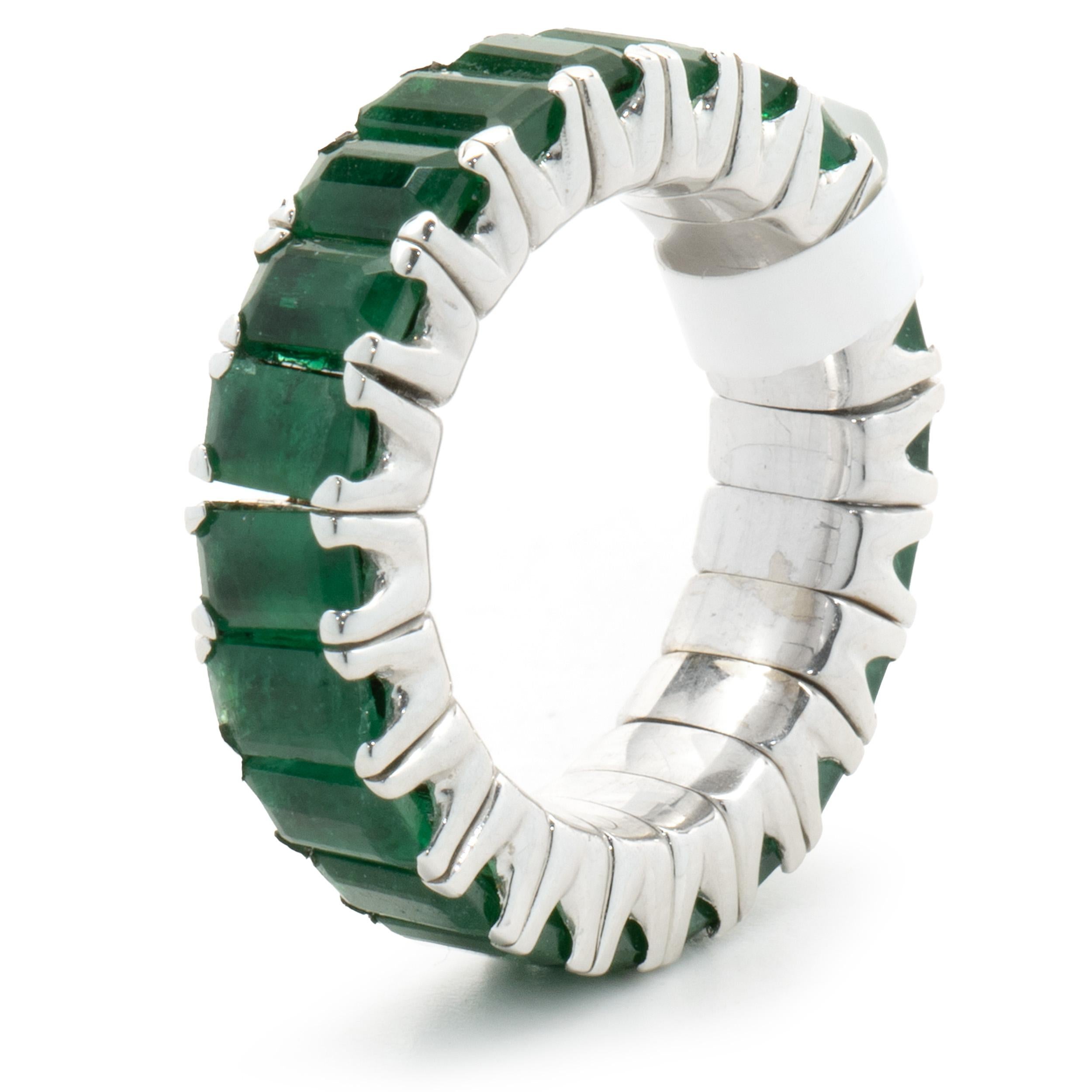 Designer: custom
Material: 18K white gold
Emerald: emerald cut = 6.74cttw
Dimension: ring top measures 6mm wide
Ring Size: 6-9  
Weight: 8.97 grams