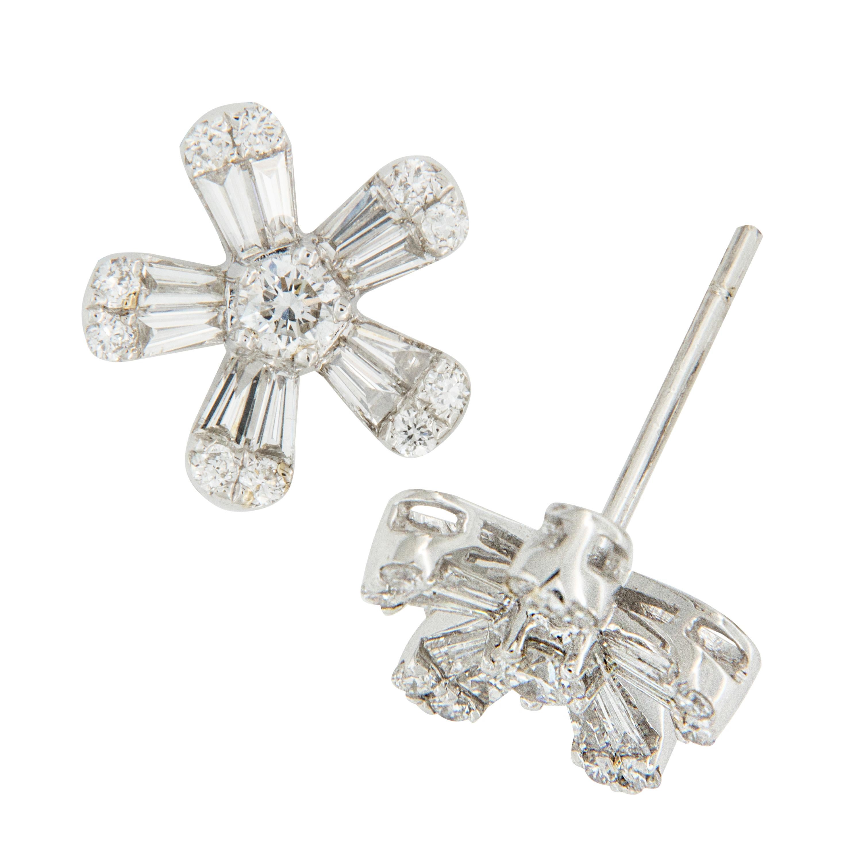 How cute are these 18 karat white gold diamond earrings? 0.24 Cttw tapered baguette & round diamonds form adorable floral star shapes that fit perfectly on your ear with posts & friction backs! 

Diamonds = 0.41 Cttw
18KWG
10.5 x 10.5mm