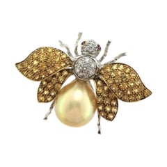 18 Karat White Gold Fly Brooch with Golden Pearl, Yellow Sapphires and Diamonds