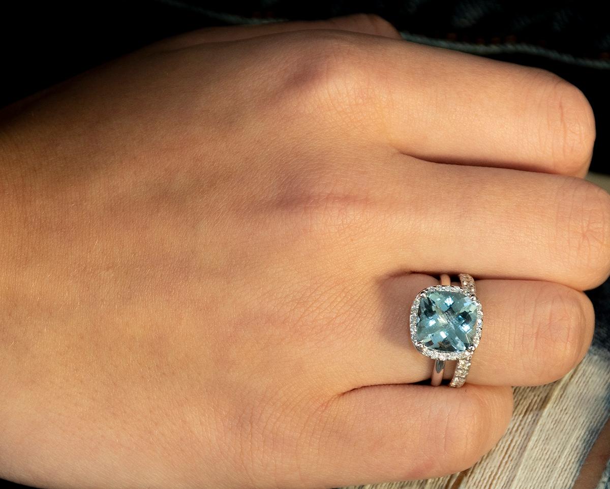 18k white gold cocktail cluster ring 
Featuring 4.08 cushion shape aquamarine 
Halo style diamond 
Surrounded by  pave set diamonds weighing 0.25
Ring finger size 6 In Stock
New Ring
Ring can be resized by 1/2 to one size
Handmade in the USA
Our