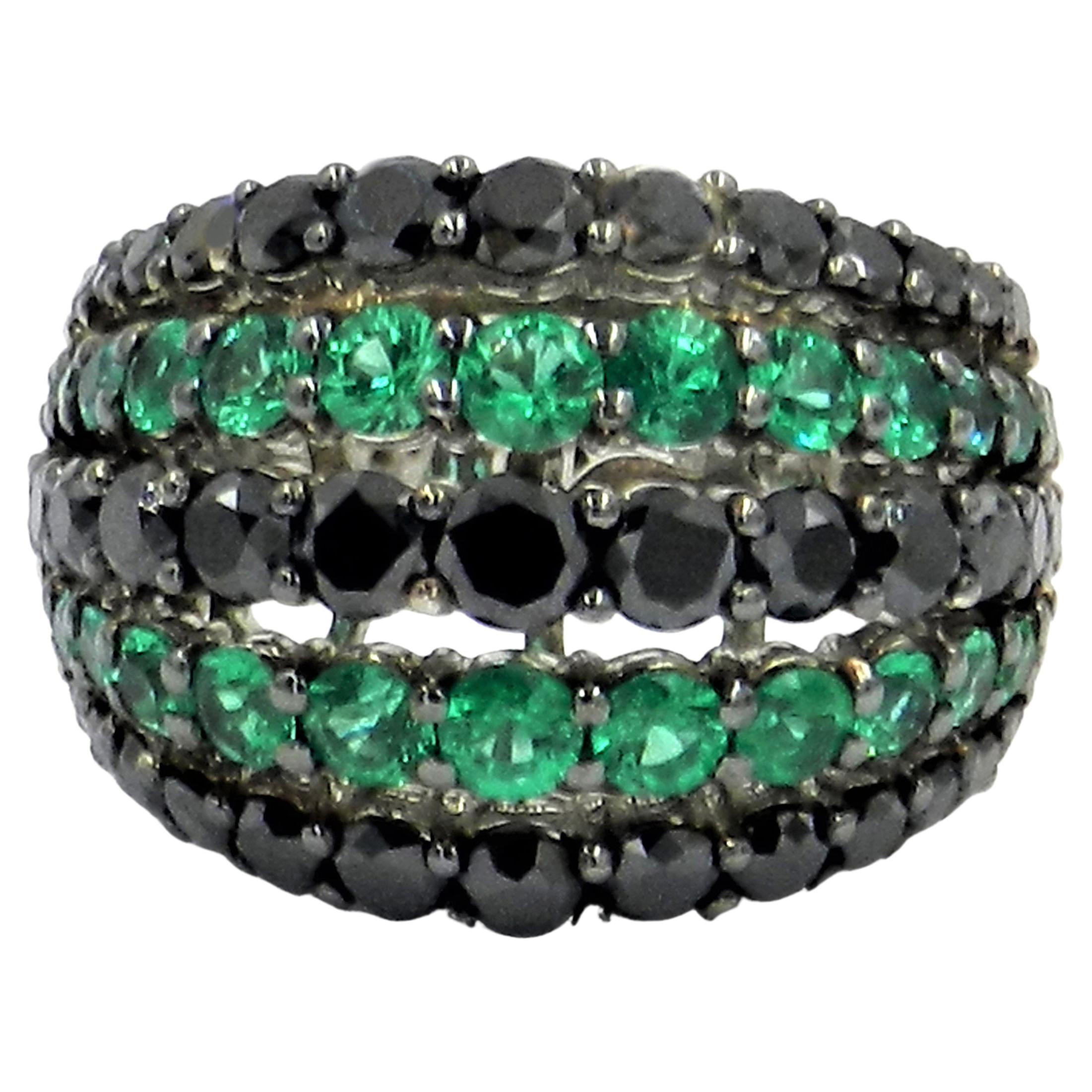 18 Karat White Gold Garavelli Ring with Black Diamonds and Emeralds For Sale
