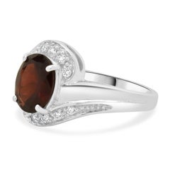 18 Karat White Gold Garnet and Diamond Bypass Ring