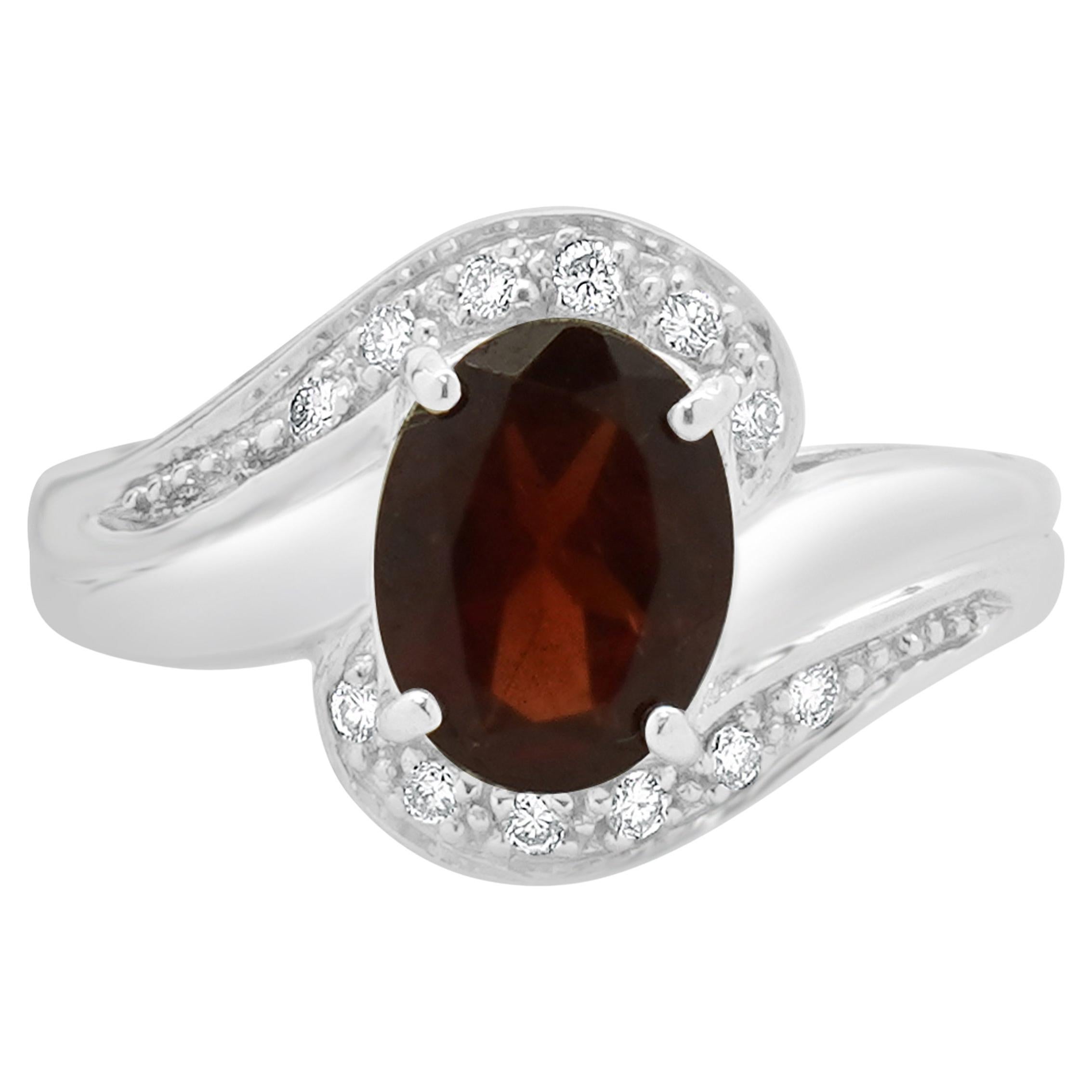 18 Karat White Gold Garnet and Diamond Bypass Ring
