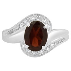 18 Karat White Gold Garnet and Diamond Bypass Ring