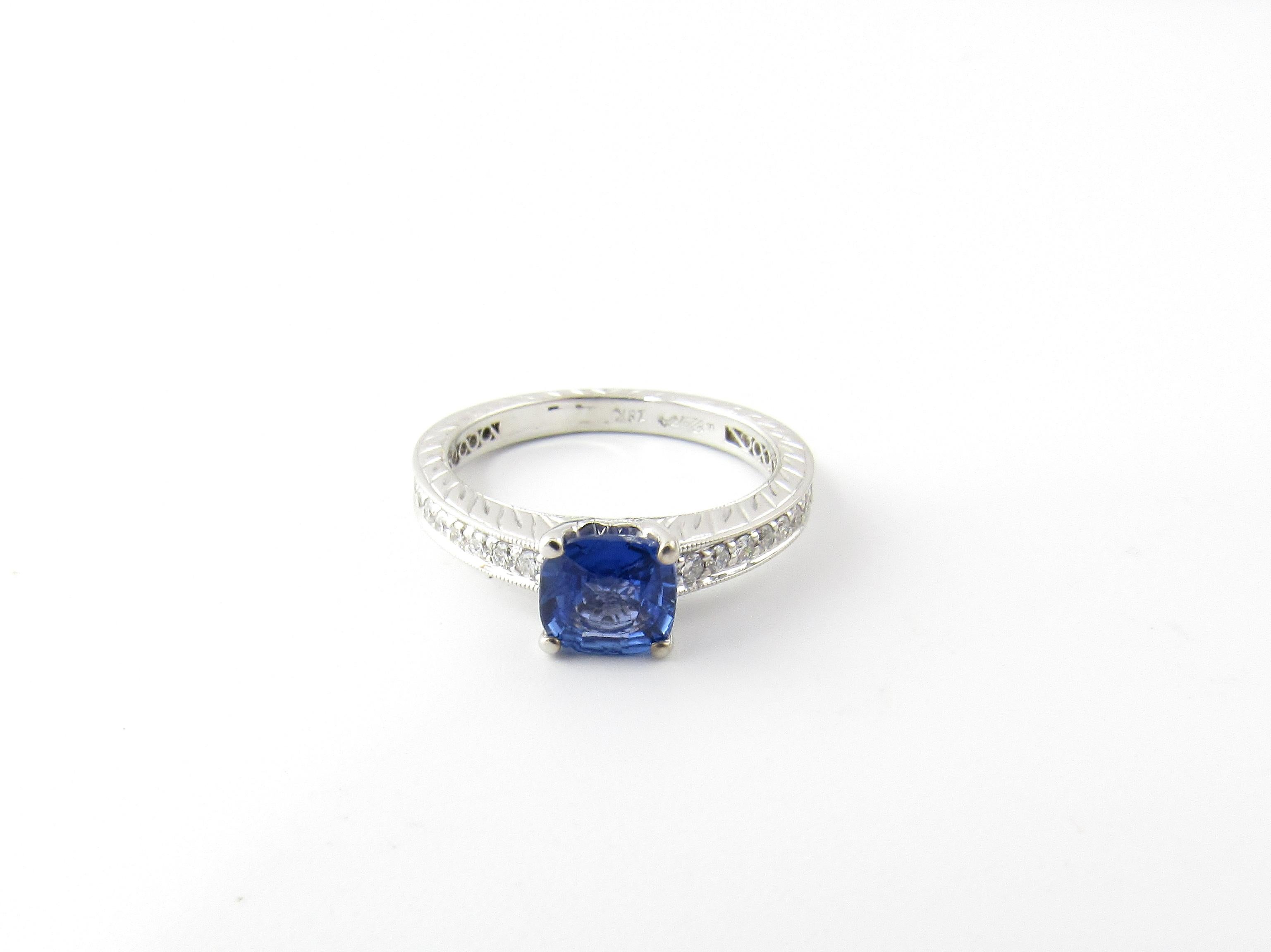 GAI Certified 18 Karat White Gold Genuine Tanzanite and Diamond Ring Size 6.25-

This stunning ring features one genuine tanzanite (6 mm x 6 mm) accented with 39 round brilliant cut diamonds set in beautifully detailed 18K white gold.  Shank