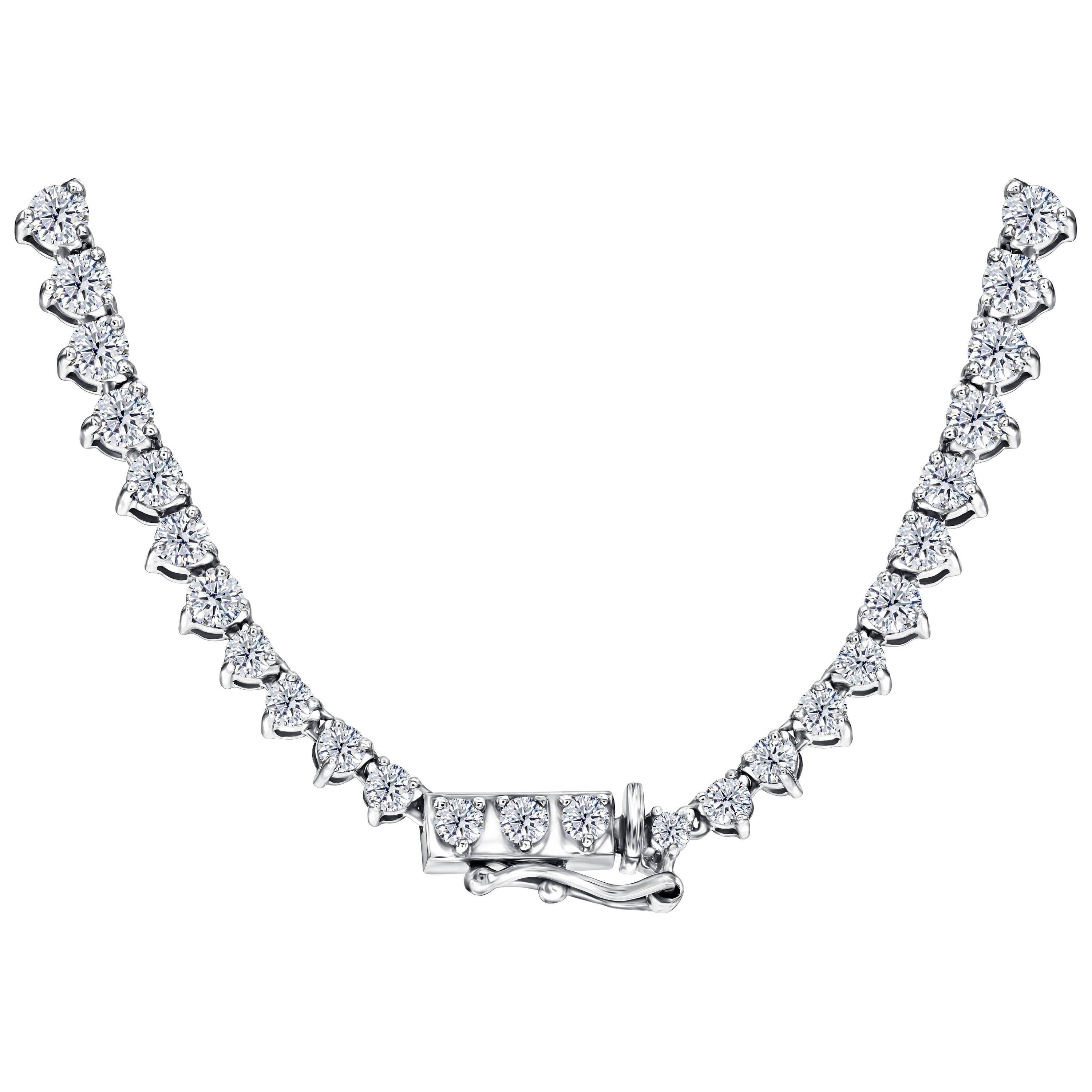 An exquisite classic round brilliant diamond straight-line necklace. This 114 round brilliant cut diamond necklace is perfect for every occasion. 17 inches long with a total diamond weight of 10 carats. Quality grading is white color H and clarity