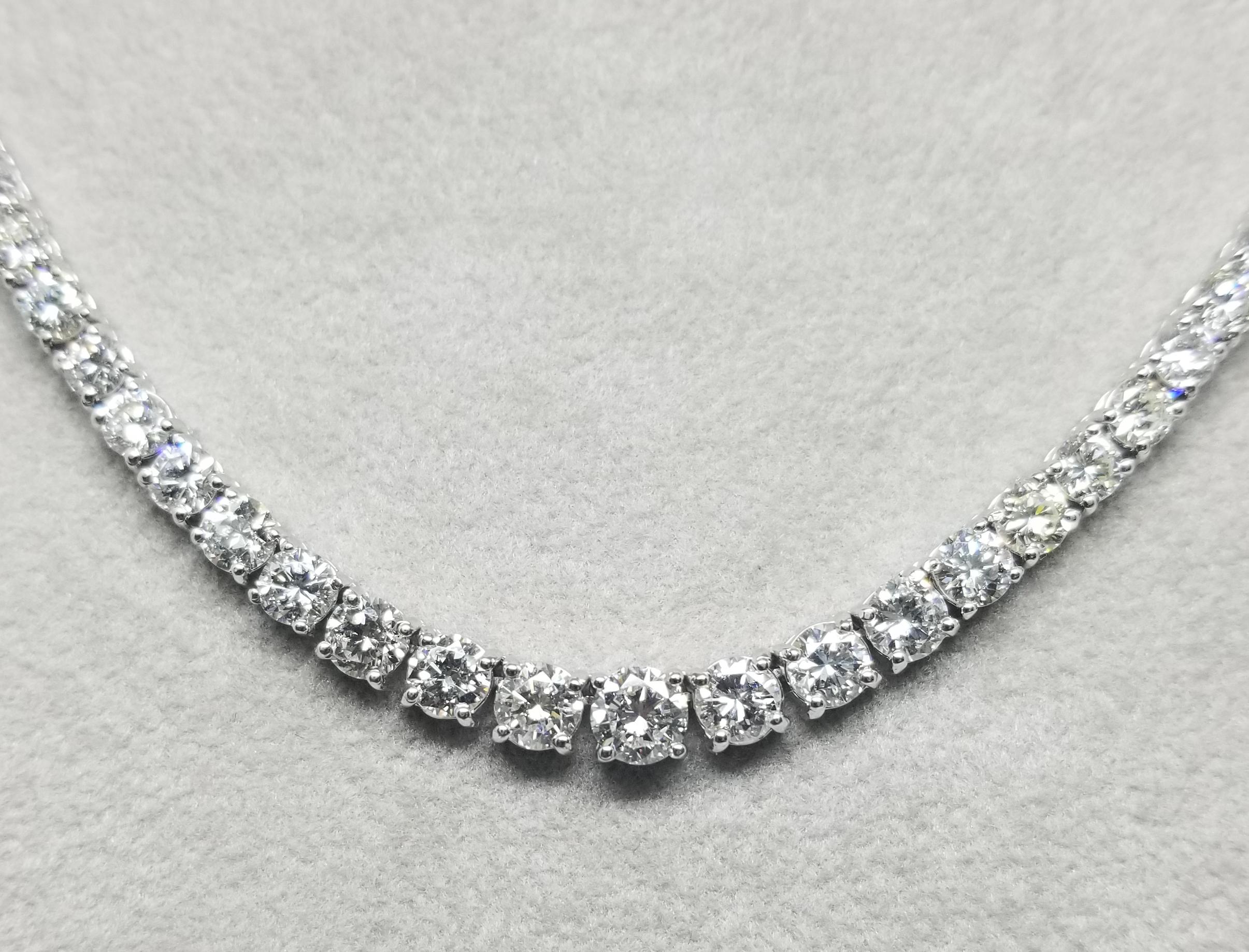 18k white gold graduated 4 prong diamond necklace, containing 
 Specifications:
    main stone: ROUND CUT DIAMONDS
    diamonds: 145 PIECES
    carat total weight: 13.48cts.
    center diamond:  4.9mm
    color: G
    clarity: VS2
    brand: custom
