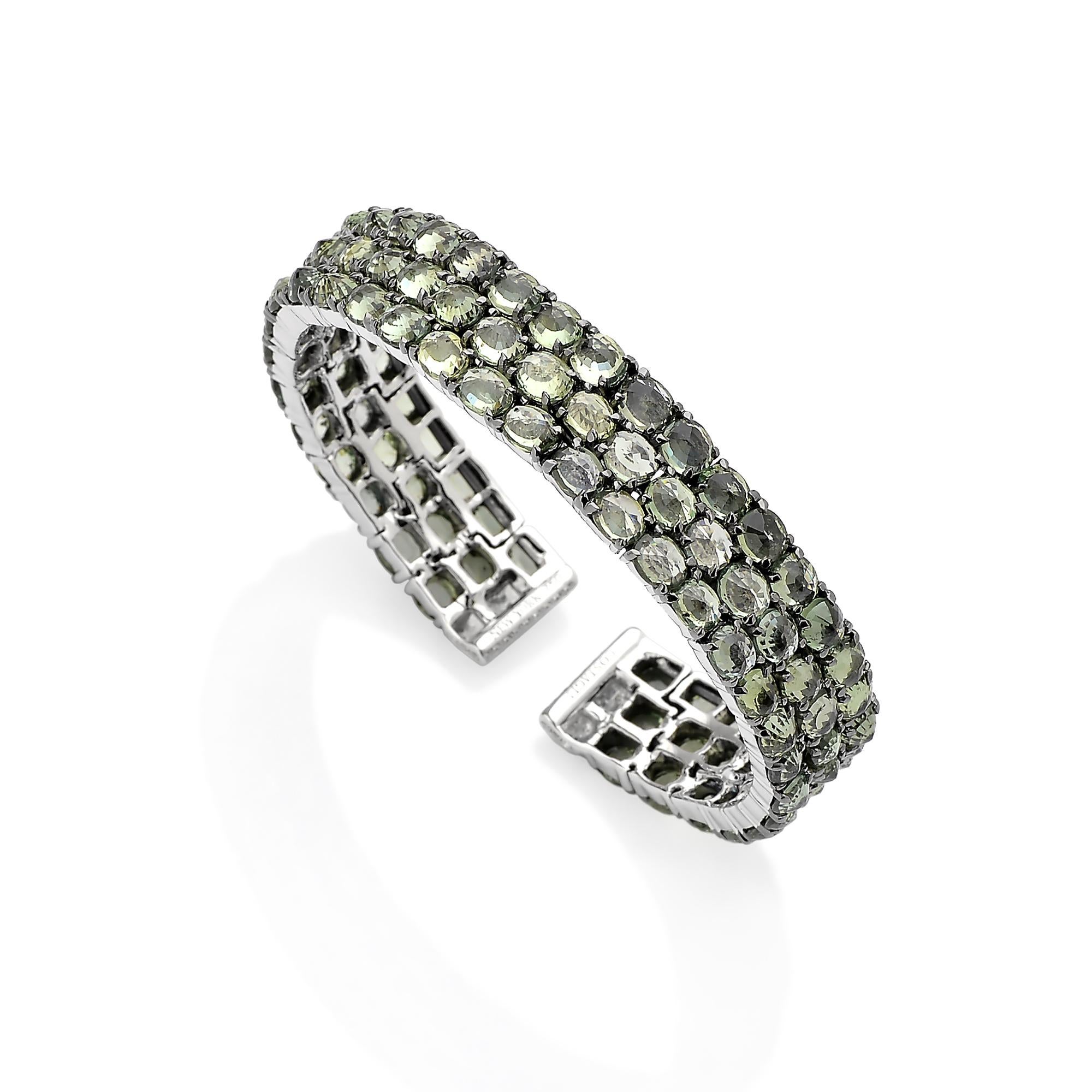 From the Ombre Collection, green sapphire flexible cuff bracelet with pave-set round, brilliant diamonds in 18 karat white gold. 

Reimagined from summers spent at the Tuscan shore, the Ombre Collection highlights the diverse hues and textures found