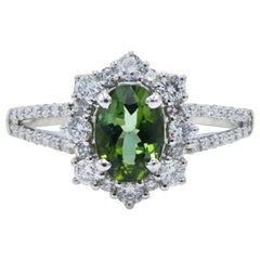 18 carat white gold ring 18 Karat White Gold Green Tourmaline and Diamond Split Shank Halo Cocktail Ring