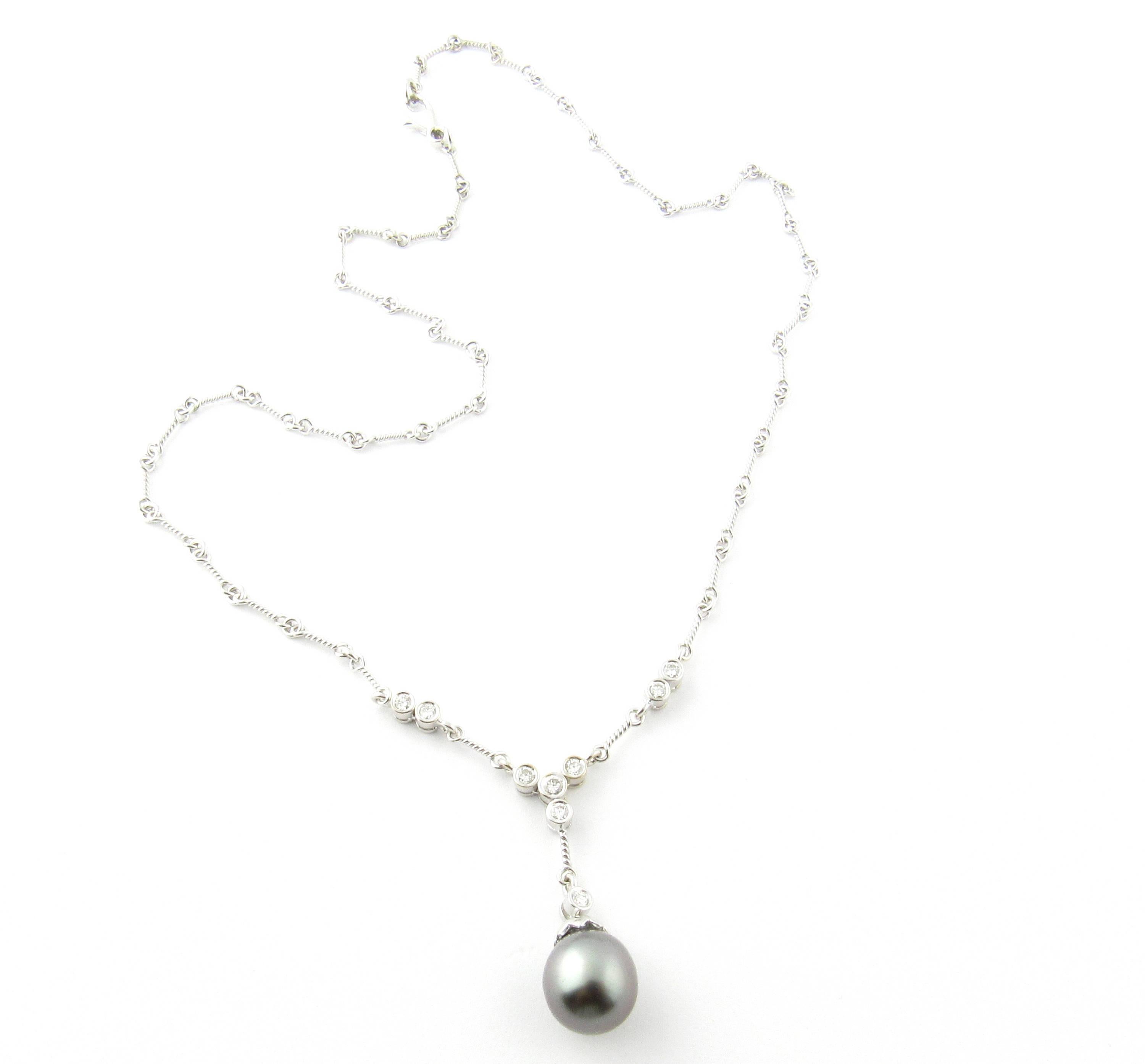 Vintage 18 Karat White Gold Grey Pearl and Diamond Necklace- 
This fabulous drop necklace features a stunning cultured grey pearl (10 mm) hanging from a beautifully crafted 18K white gold 