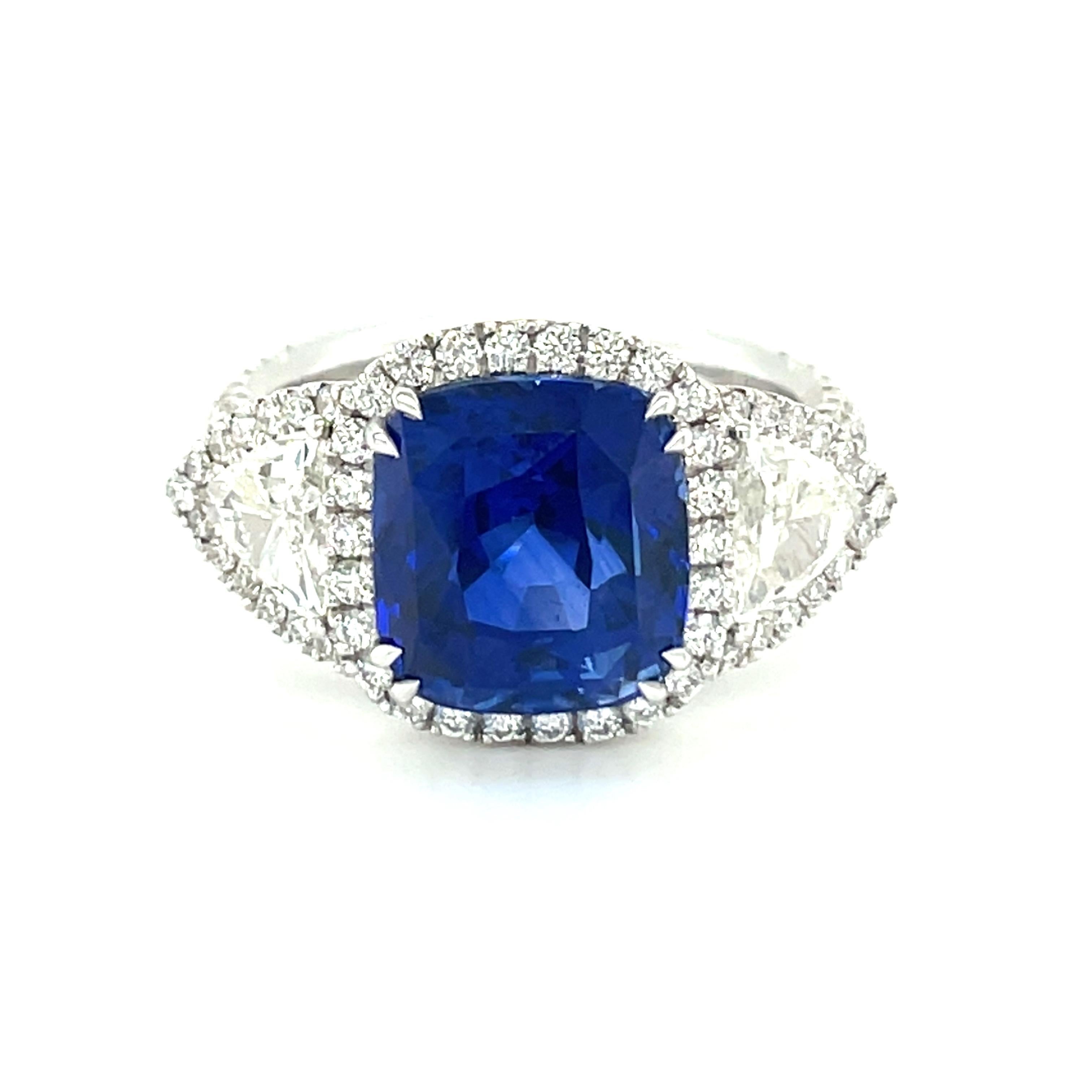 18K white gold diamond ring is from our Timeless Collection. This stunning piece of jewellery is made of a GRS certified cushion cut 8.5 Carat natural sapphire in vivid blue color. The origin of the sapphire is Sri Lanka. The sapphire is decorated