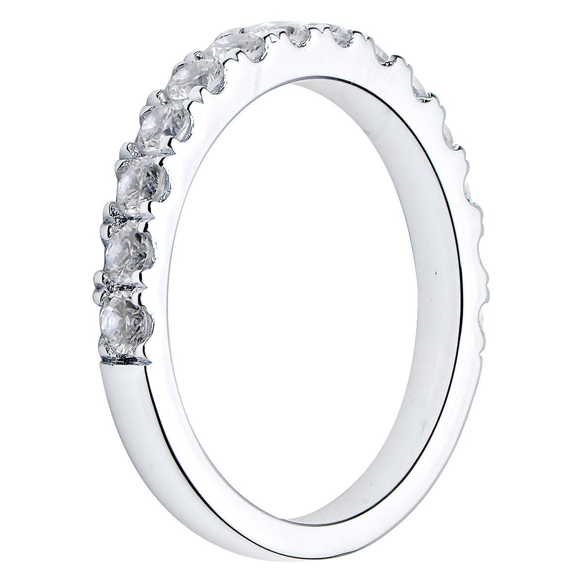This beautiful band has VS2, G quality diamonds going halfway around the band. There are 14 round diamonds totaling 0.76 carats. The ring is made from 3.2 grams of 18 karat white gold and is size 5. 