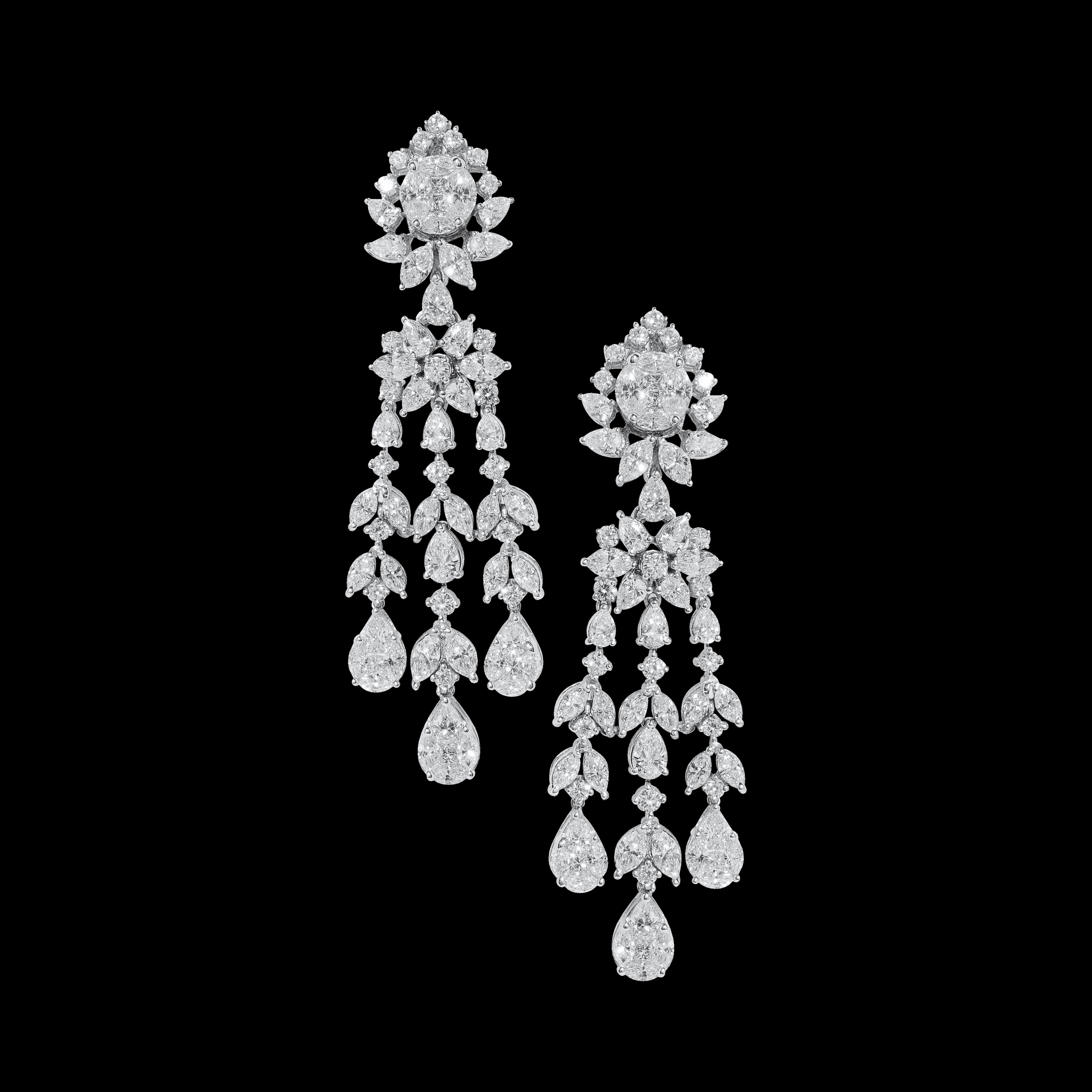 IGI Certified 18 Karat White Gold Handcrafted Diamond Bridal Necklace Set

Handcrafted diamond necklace and earrings studded with white diamonds (FGH - VVS/VS purity) set in 18 karat white gold. 

We have created this bridal set using different