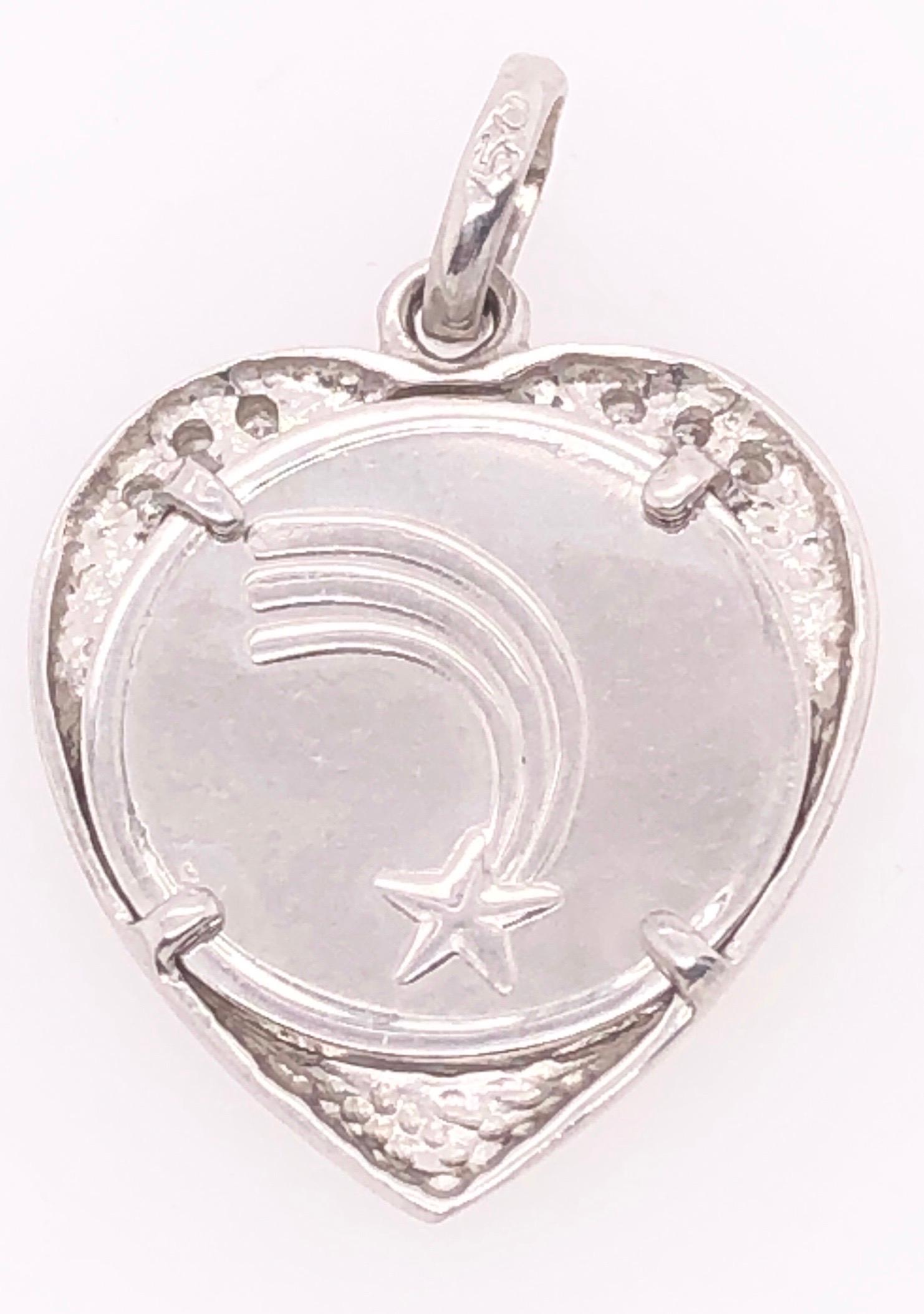 18 Karat White Gold Heart / Religious Pendant with Diamond Accents 0.06 TDW.
2.41 grams total weight.