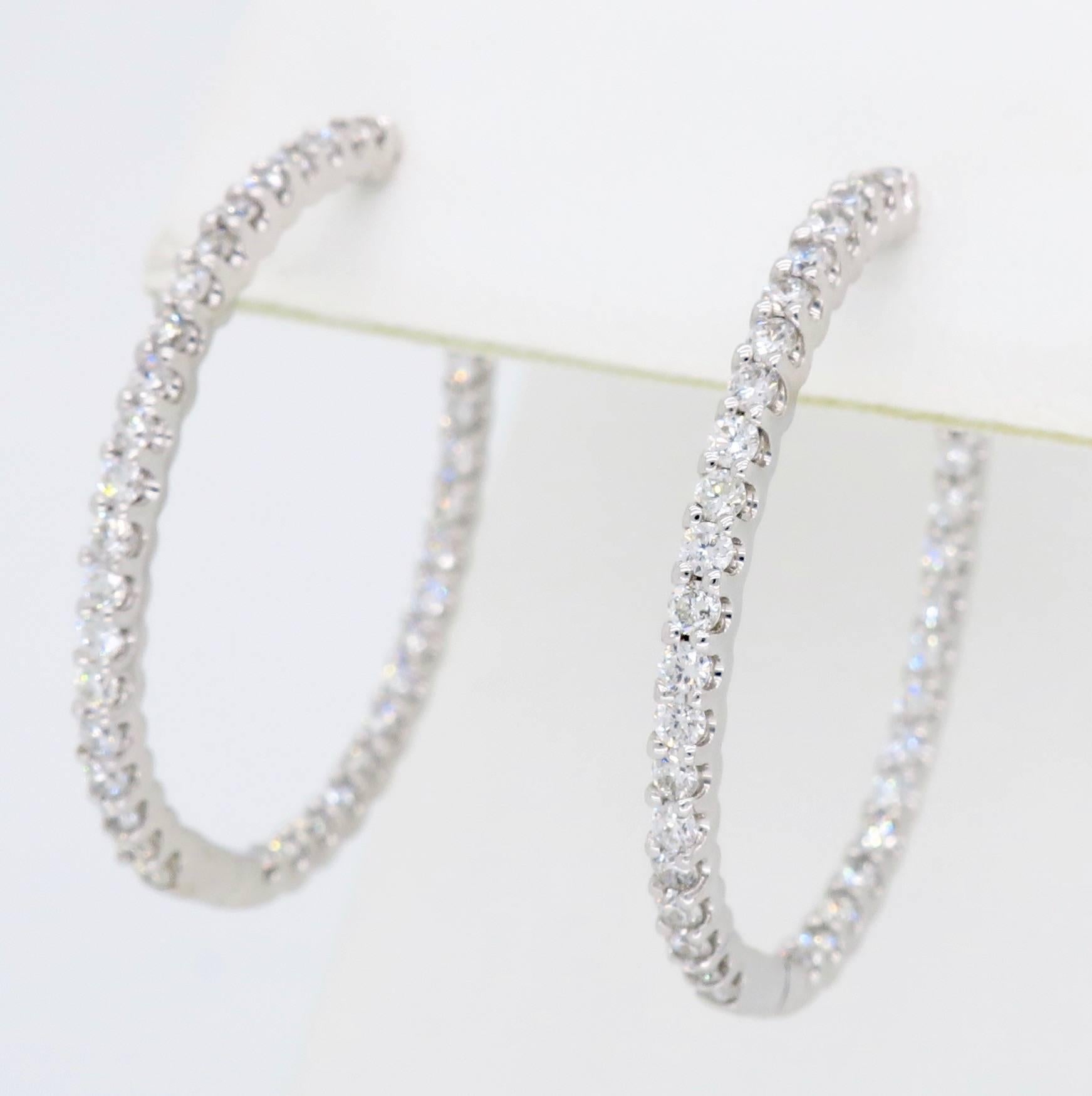 These beautiful oval shaped inside out style hoops feature 1.18CTW of Round Brilliant Cut Diamonds.

Diamond Carat Weight: 1.18CTW
Diamond Cut: 74 Round Brilliant Cut Diamonds
Color: Average G-J
Clarity: Average VS
Metal: 18K White