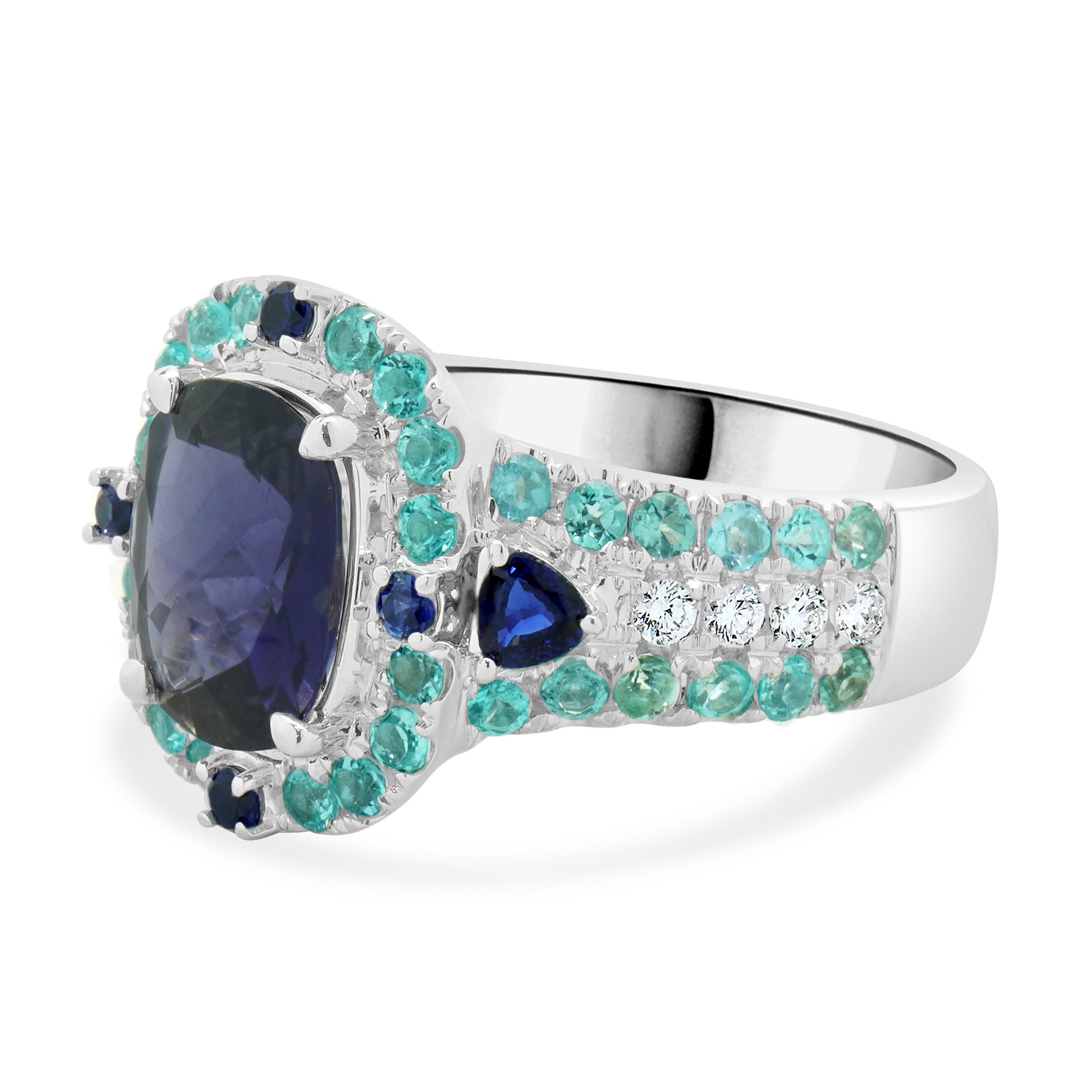 Designer: custom
Material: 18K white gold
Diamond: 8 round brilliant cut = 0.16cttw
Color: G
Clarity: SI1
Iolite: 1 cushion cut = 1.92ct
Paraiba Tourmaline: round cut = 1.15cttw
Ring Size: 7.5 (please allow two extra shipping days for sizing