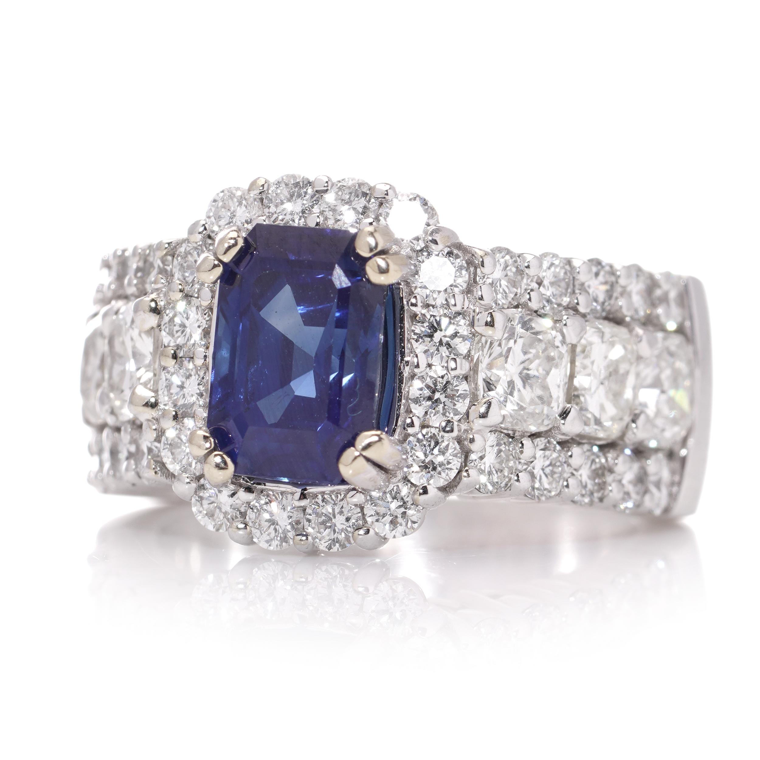 18kt white gold ladies ring with natural Corundum sapphire with diamonds.
Circa 2000's

Dimensions - 
Weight : 14 grams
Finger Size (UK) = M (US) = 6 1/2 (EU) = 52 1/2
Size : 2.7 x 2.3 x 1.3 cm

Sapphire - 
Shape : Octagonal
Cutting Style : Step