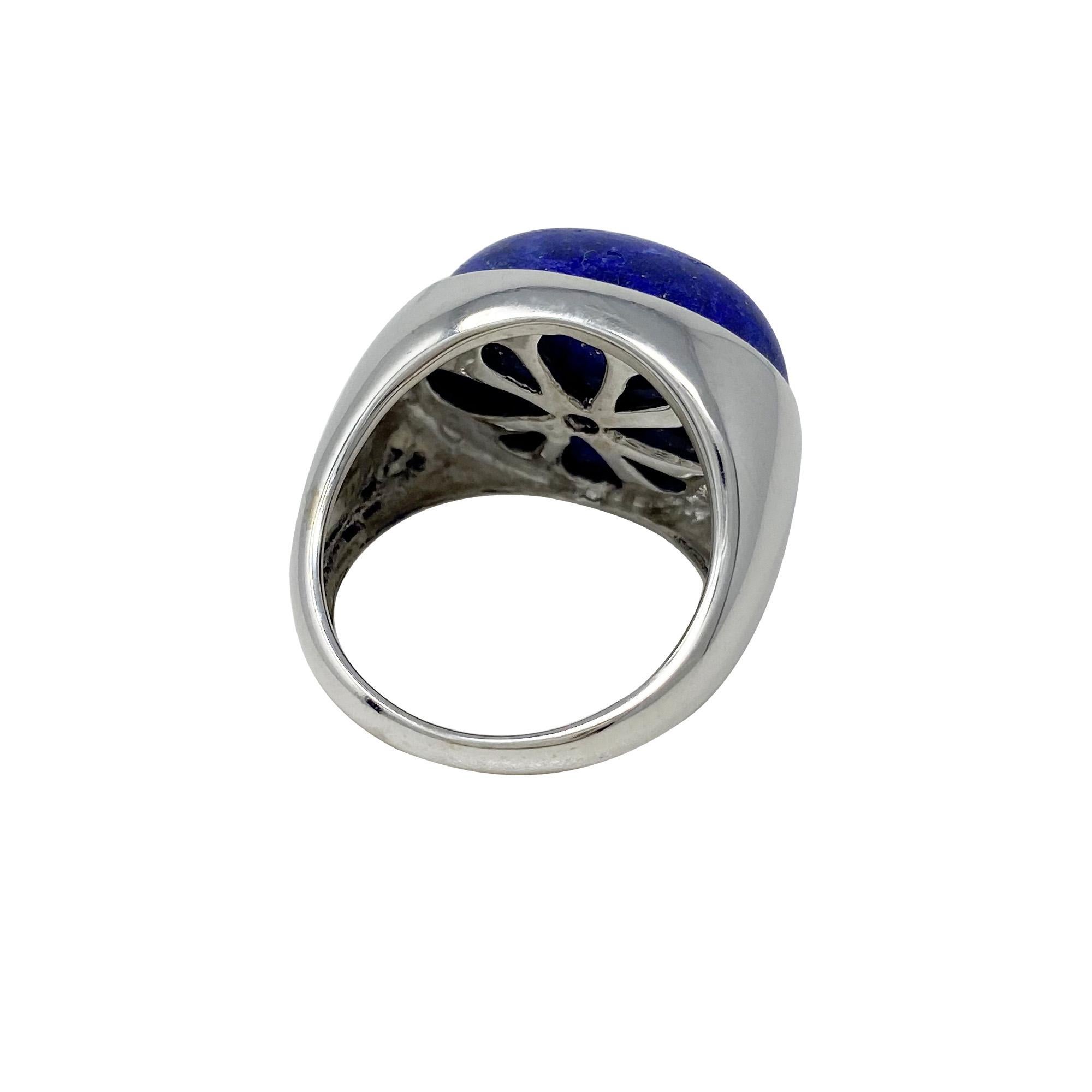 The oval-shaped, cabochon-cut lapis lazuli is a lovely shade of blue and the 18 karat white gold mounting and the yellow pyrite in the stone go beautifully together!  Size 9 1/4