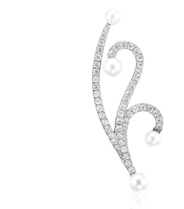 Elegant and modern, our Lucy Pearl & Diamond Earrings will make a statement with their sleek design. These earring features fluid curves of pave diamonds set against exquisite freshwater pearls on both sides for an elegant twist that is sure to be