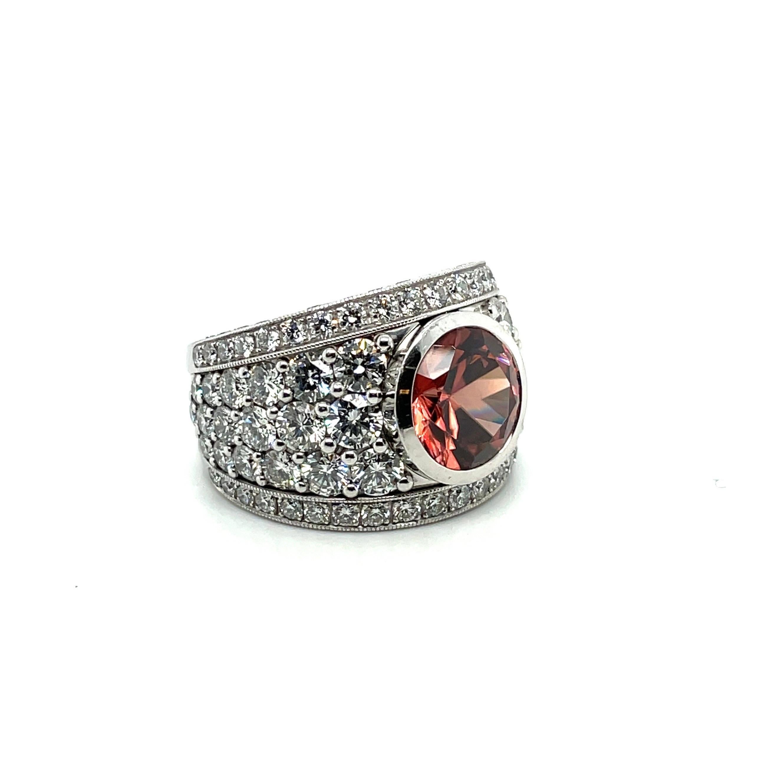 Exquisite 18 karat white gold Malaya Zircon and Diamond Cocktail ring, by renowned Swiss Jeweller Péclard. 

Eye-catching, slightly bombé Cocktail ring, centering upon a fine, round, pink-brown Malaya Zircon of approximately 7.14 carats, and