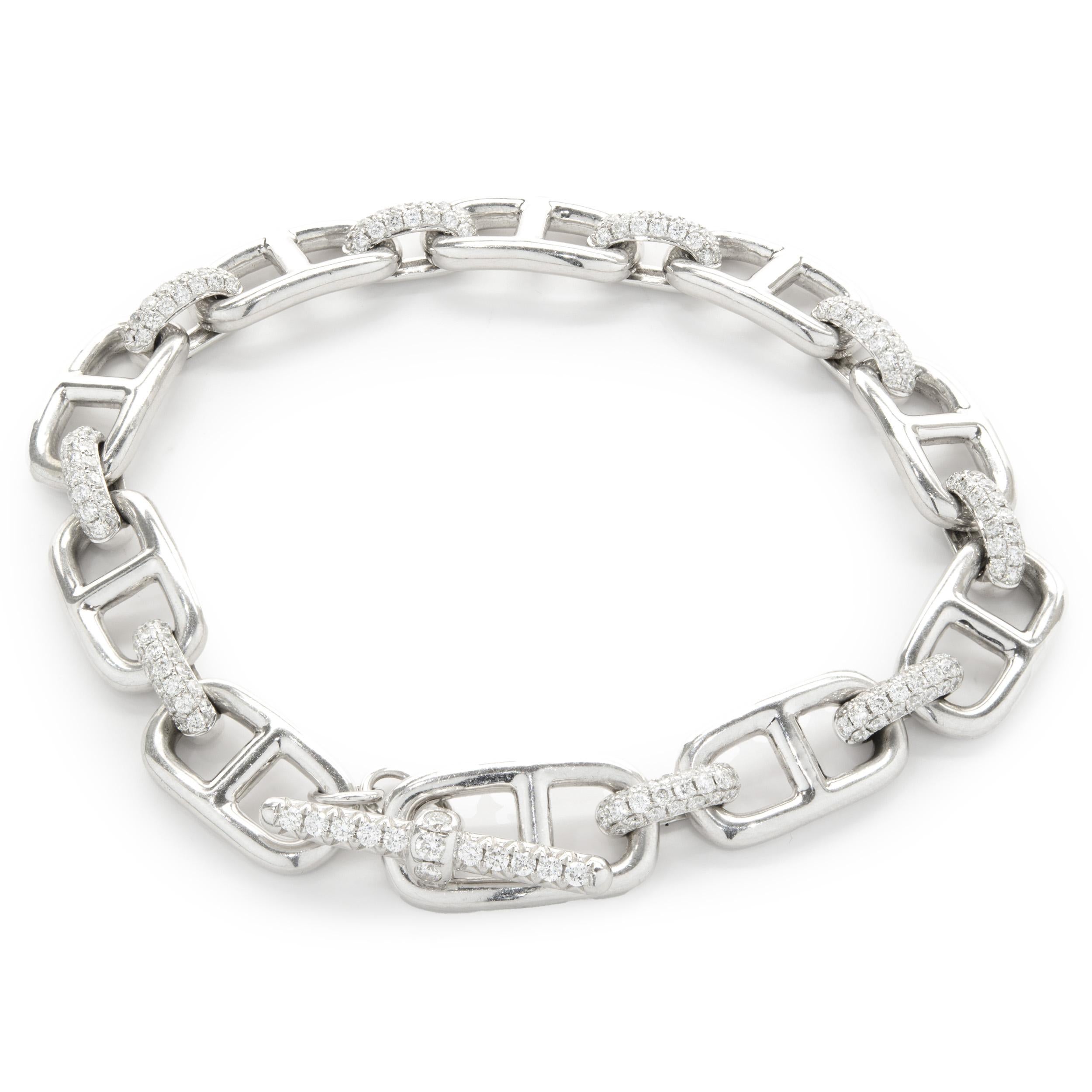 Designer: custom design
Material: 18K white gold
Diamonds: 213 round brilliant cut = 1.83cttw
Color: G
Clarity: VS2
Dimensions: bracelet will fit up to a 7.5-inch wrist
Weight: 23.62 grams
