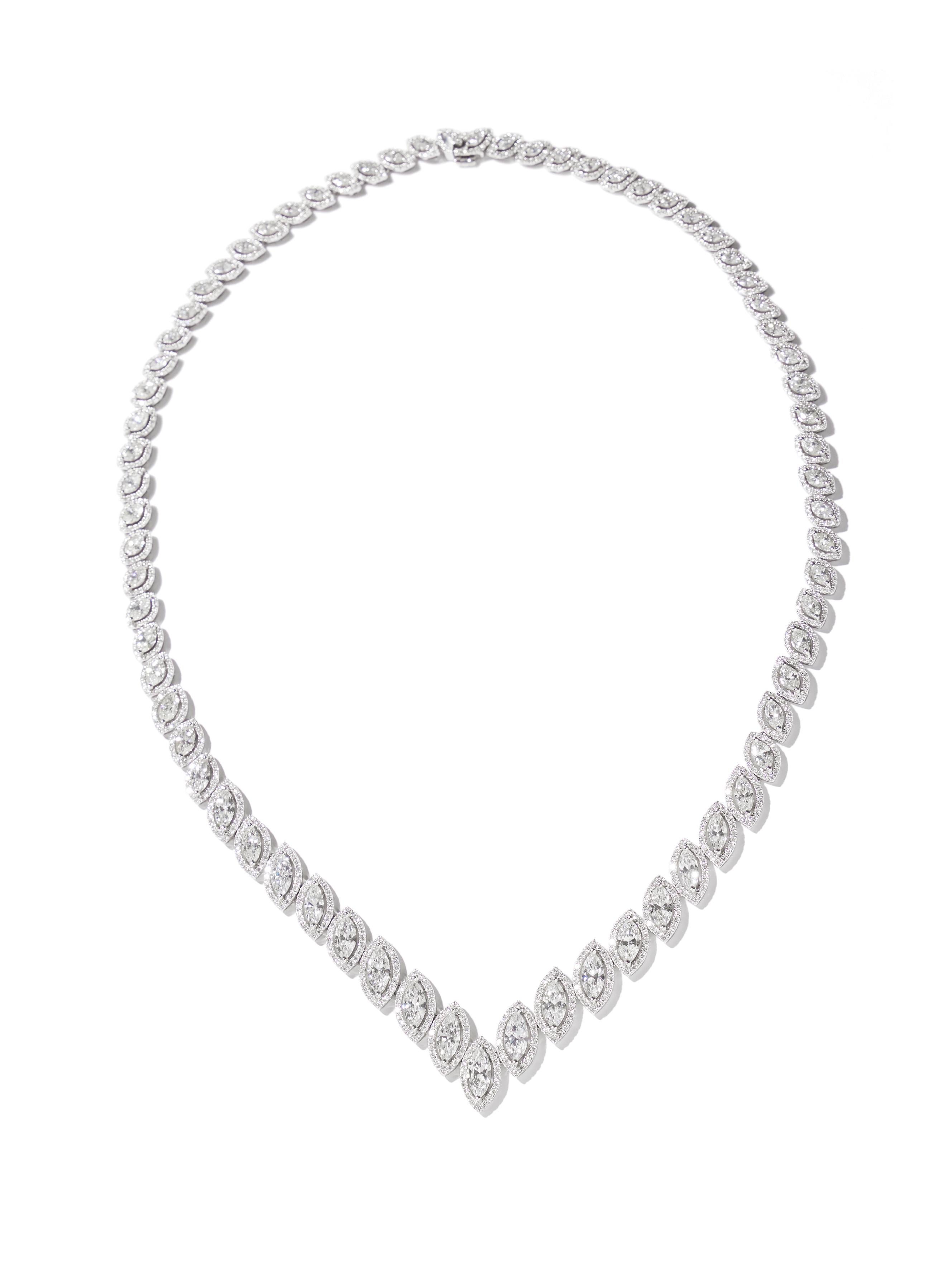 Not your ordinary diamond necklace, but a waterfall of marquise-cut diamonds of no less than 15.22cts. This necklace follows the neckline with absolute perfection, crafted in 18kt white gold.

This navette diamond necklace is a handmade eye-catcher