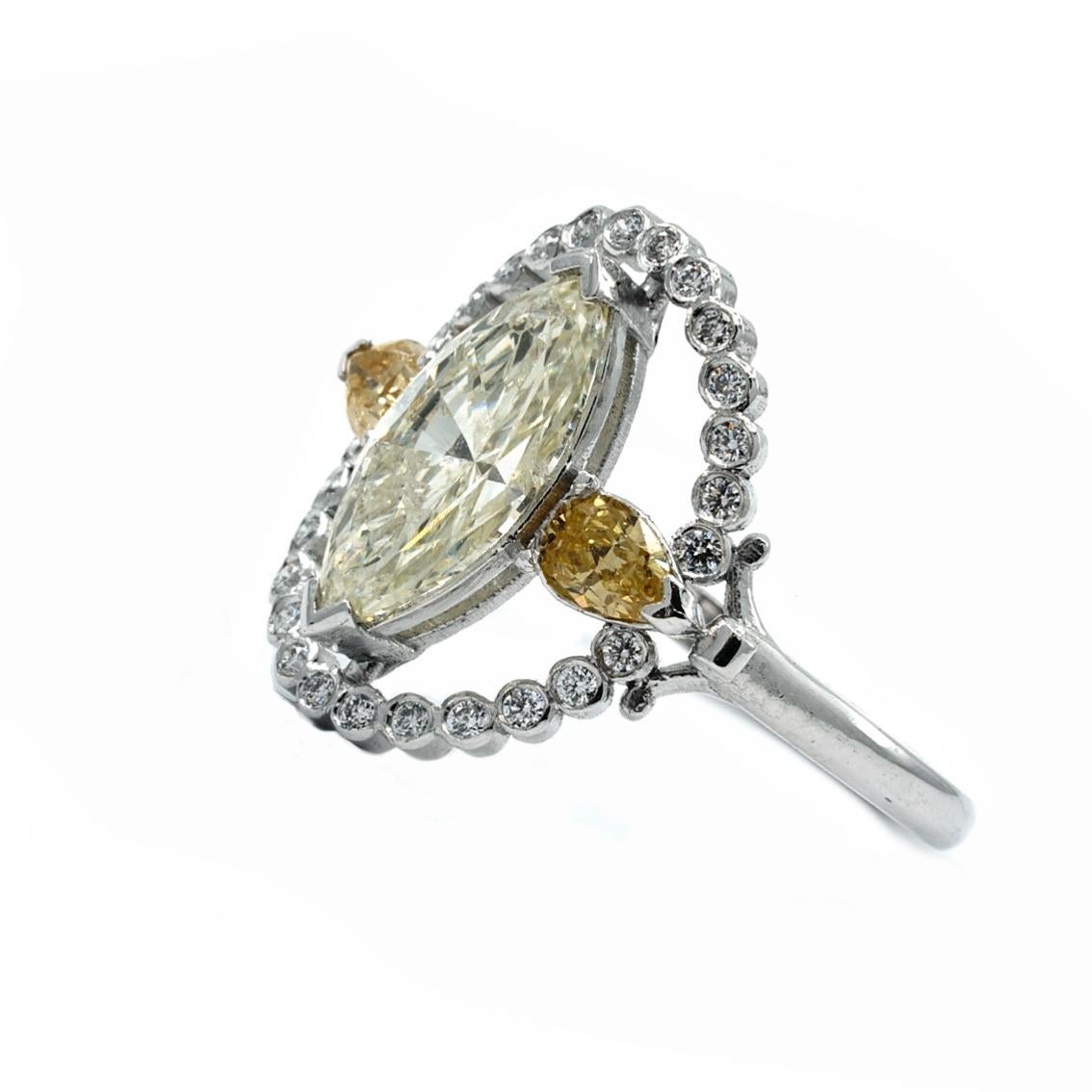 Victorian Marquise Halo Ring in 18 Karat White Gold with White and Yellow Diamonds For Sale