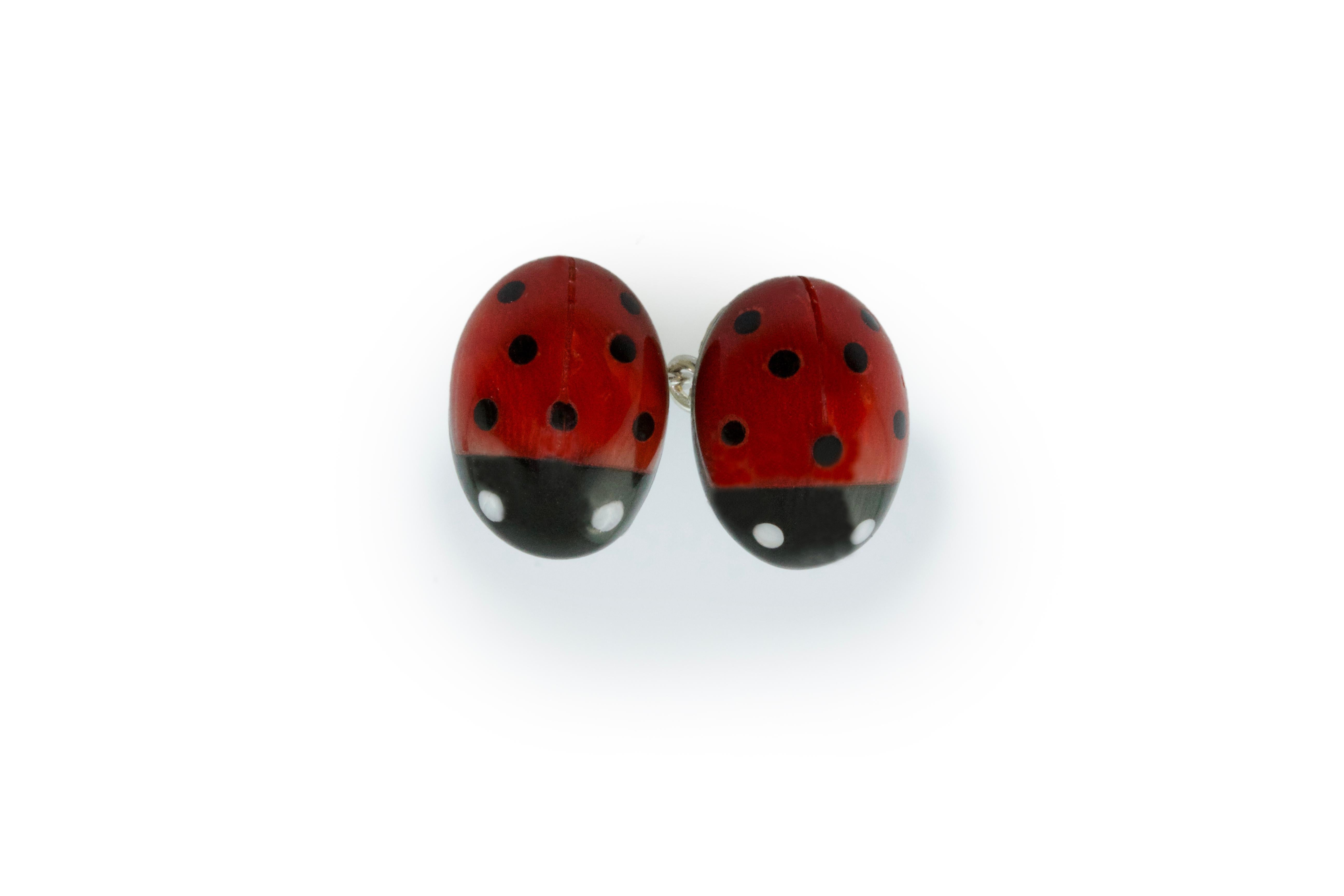 These elegant cufflinks are made of coral sourced in the Mediterranean and Onyx, both front face and toggle have been hand-carved shaped like a ladybug with a smooth, bulging surface. 
The post in the back is made of 18 karat white gold.

All