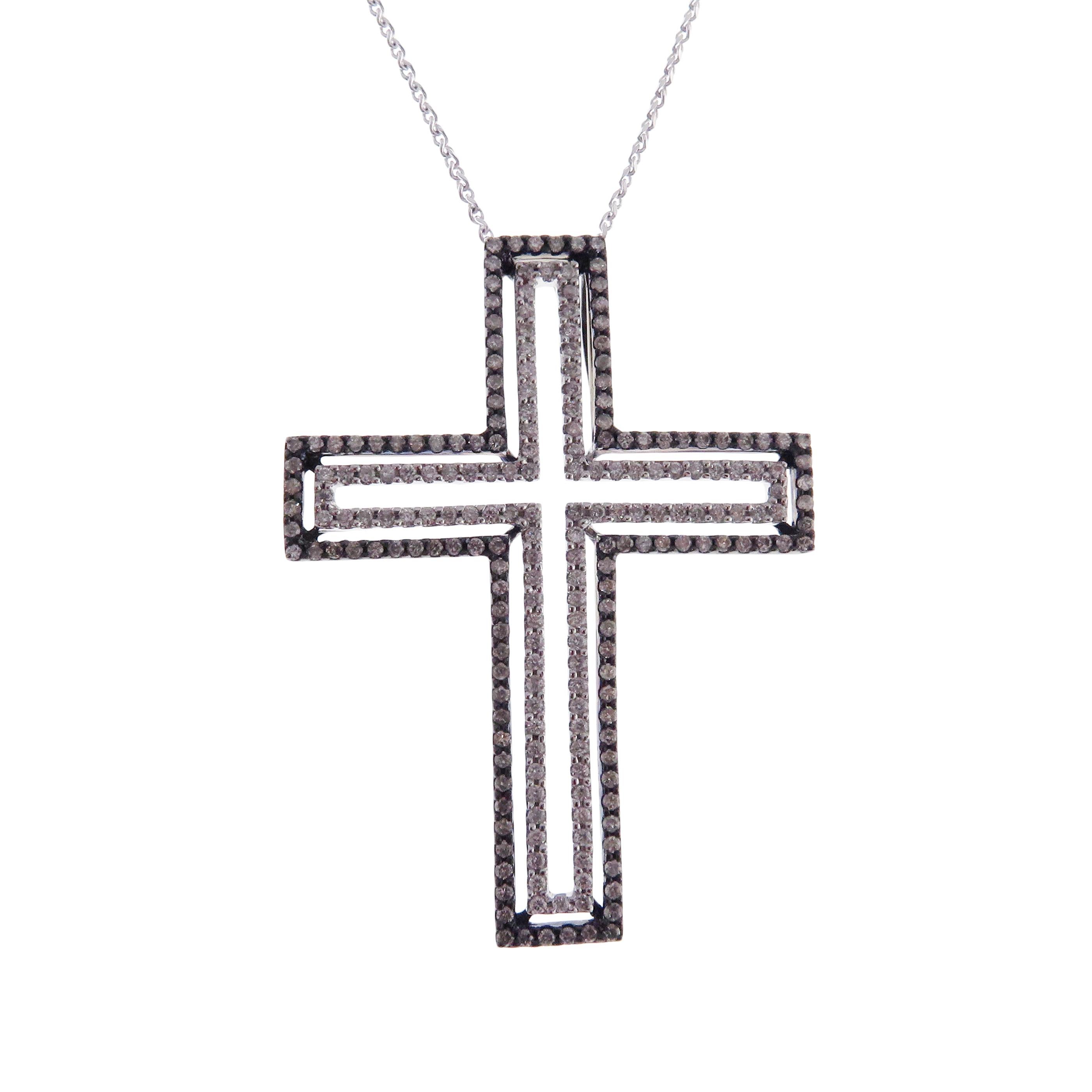 This cross motif necklace is crafted in 18-karat white gold, weighing approximately 1.42 total carats of SI-Quality white diamond. Outer border of cross has black rhodium accents. 

Necklace is 16