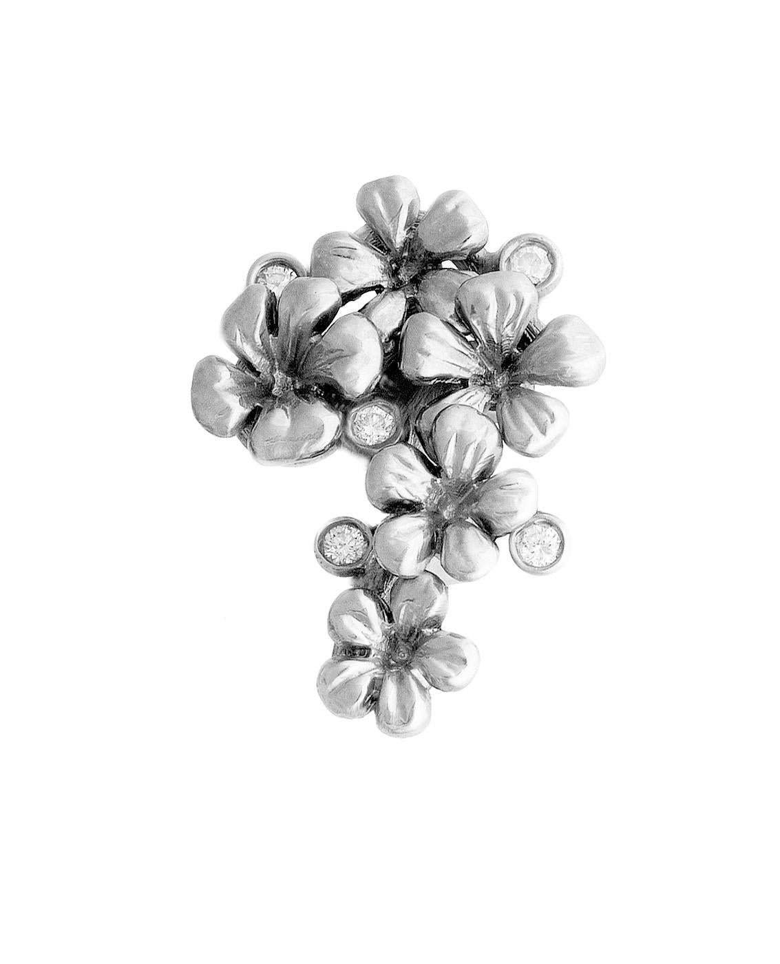 This Plum Blossom brooch is made of 18 karat white gold. It features 5 round diamonds and a removable natural emerald drop (3.96 carats, 13.5x7.5mm) that can be taken off. This jewelry collection was featured in Vogue UA and designed by the