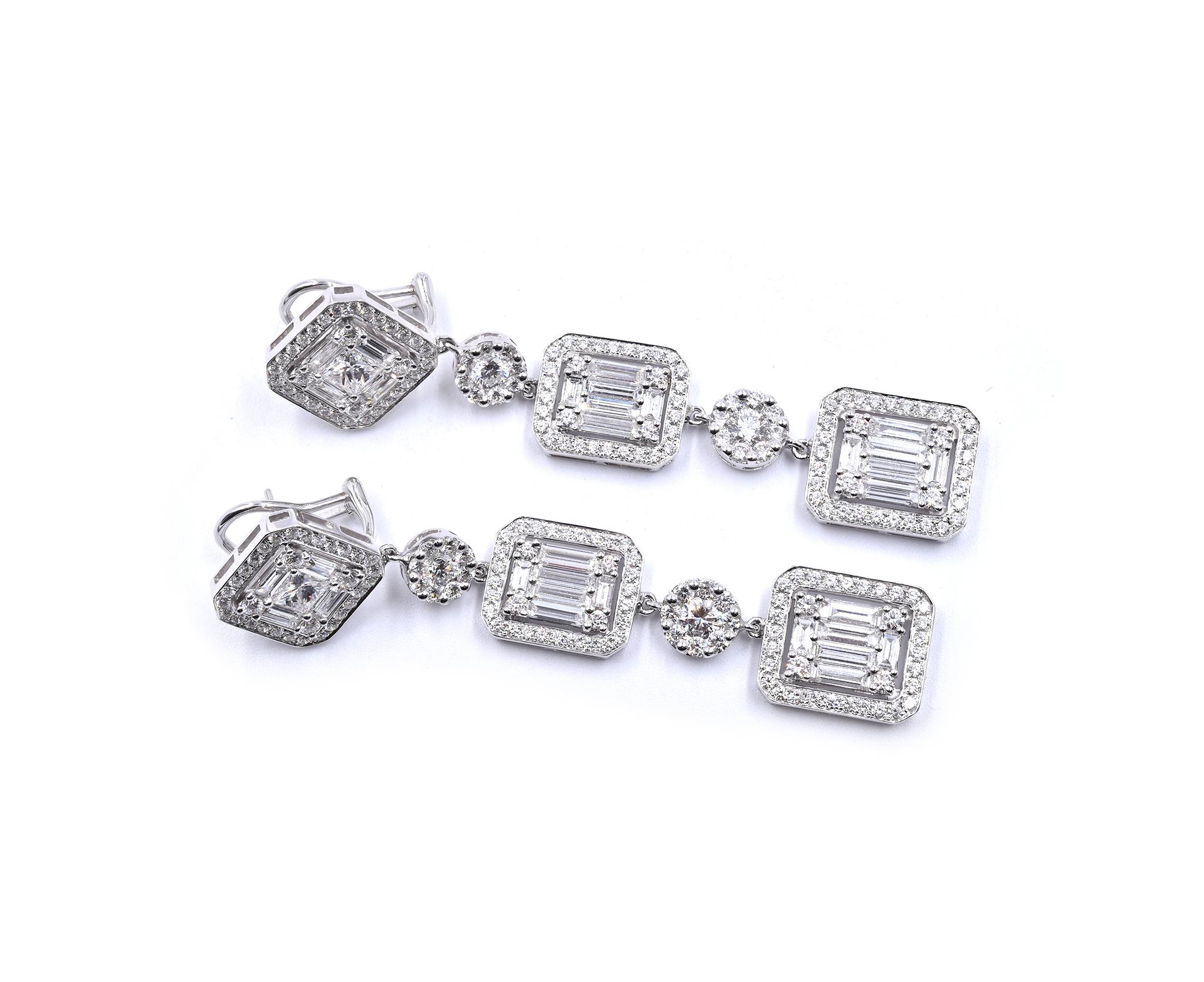 Material: 18K white gold
Diamonds: 2 princess cut = 1.04cttw
Color:  G
Clarity: VS1
Diamonds: 32 baguette cut = 4.15cttw
Color:  G
Clarity: VS1
Diamonds: 232 round cut = 4.40cttw
Color:  G
Clarity: VS1
Dimensions: earrings measure 72 X