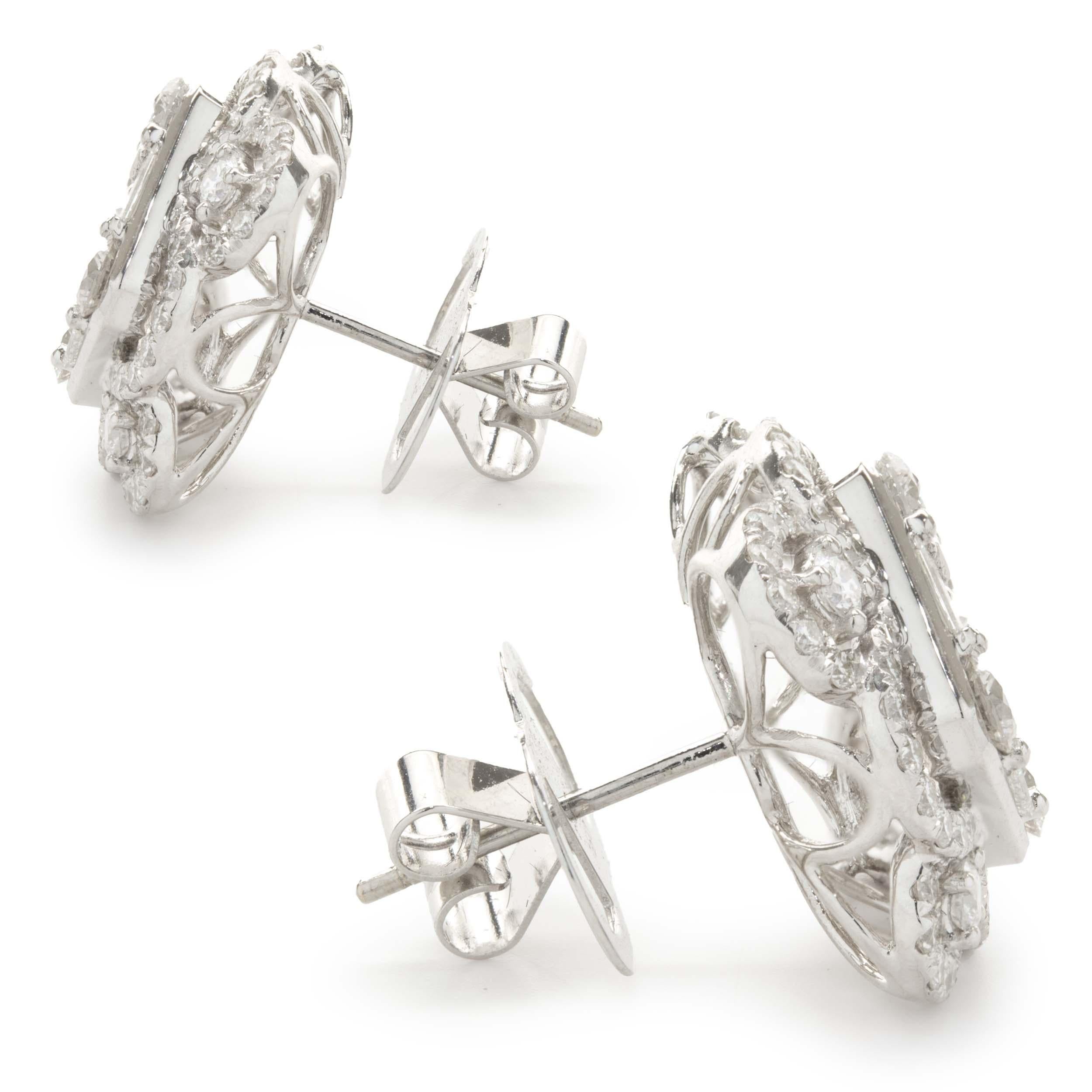 Designer: custom
Material: 18K white gold
Diamond: 124 round brilliant cut = 2.24cttw
Color: G
Clarity: SI1
Diamond: 20 baguette cut = 1.19cttw
Color: G
Clarity: SI1
Dimensions: earrings measure 19.4mm in length
Fastenings: post with