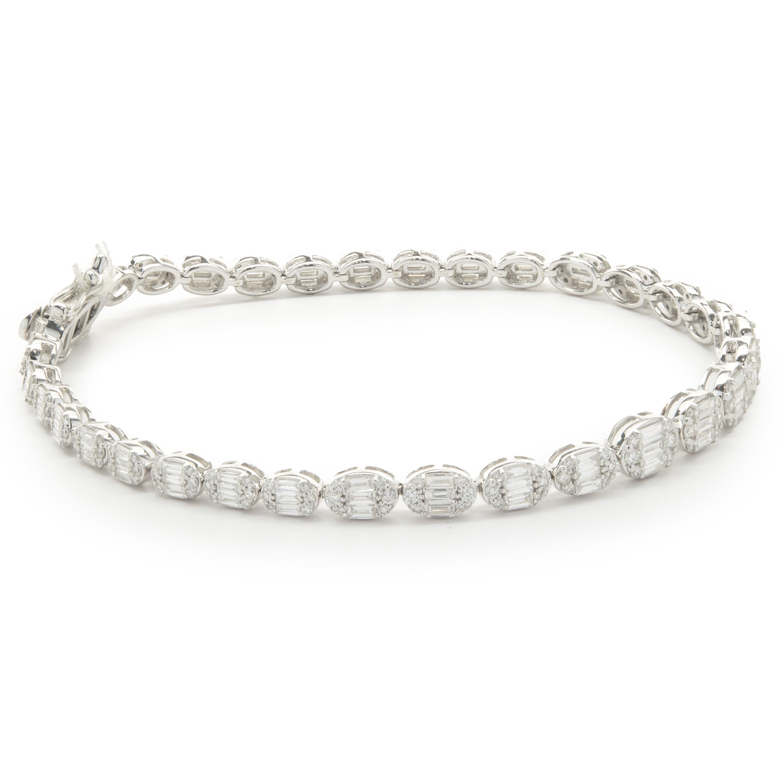 Designer: custom design
Material: 18K white gold
Diamond: 186 round brilliant cut = 0.80cttw
Color: G
Clarity: SI1
Diamonds:  93 baguette cut = 1.42cttw
Color: G 
Clarity: SI1
Dimensions: bracelet measures 7.5-inches in length
Weight: 10.85 grams